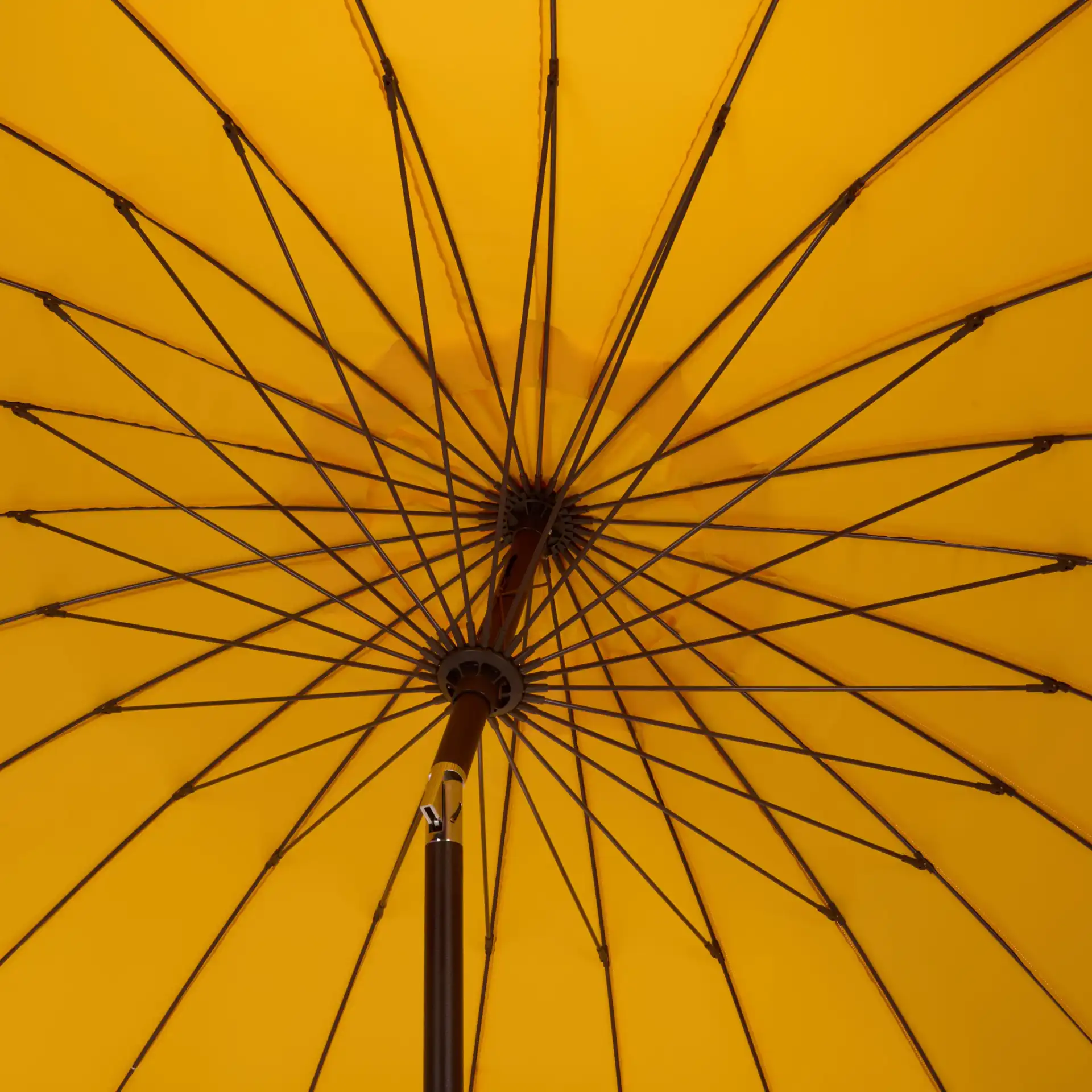 Panza 9-Foot Crank Umbrella in Yellow in a styled room