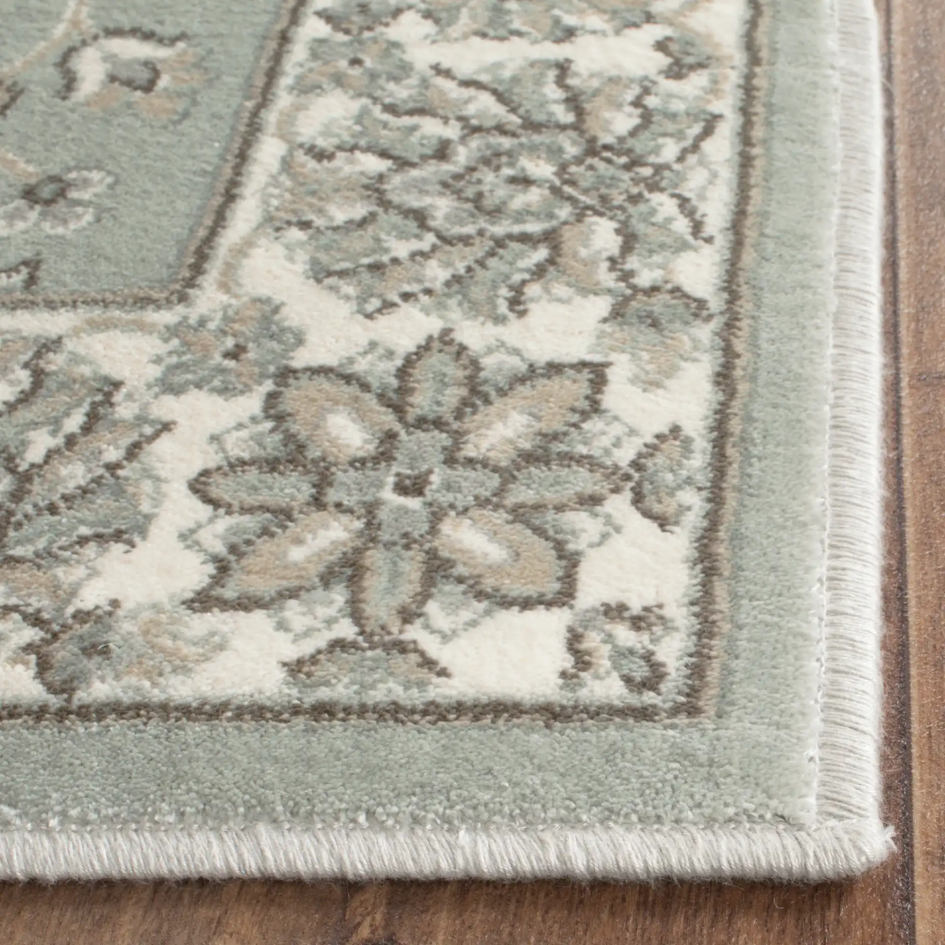 Persian Garden Floral Vine Viscose Rug in Silver / Ivory in a styled room
