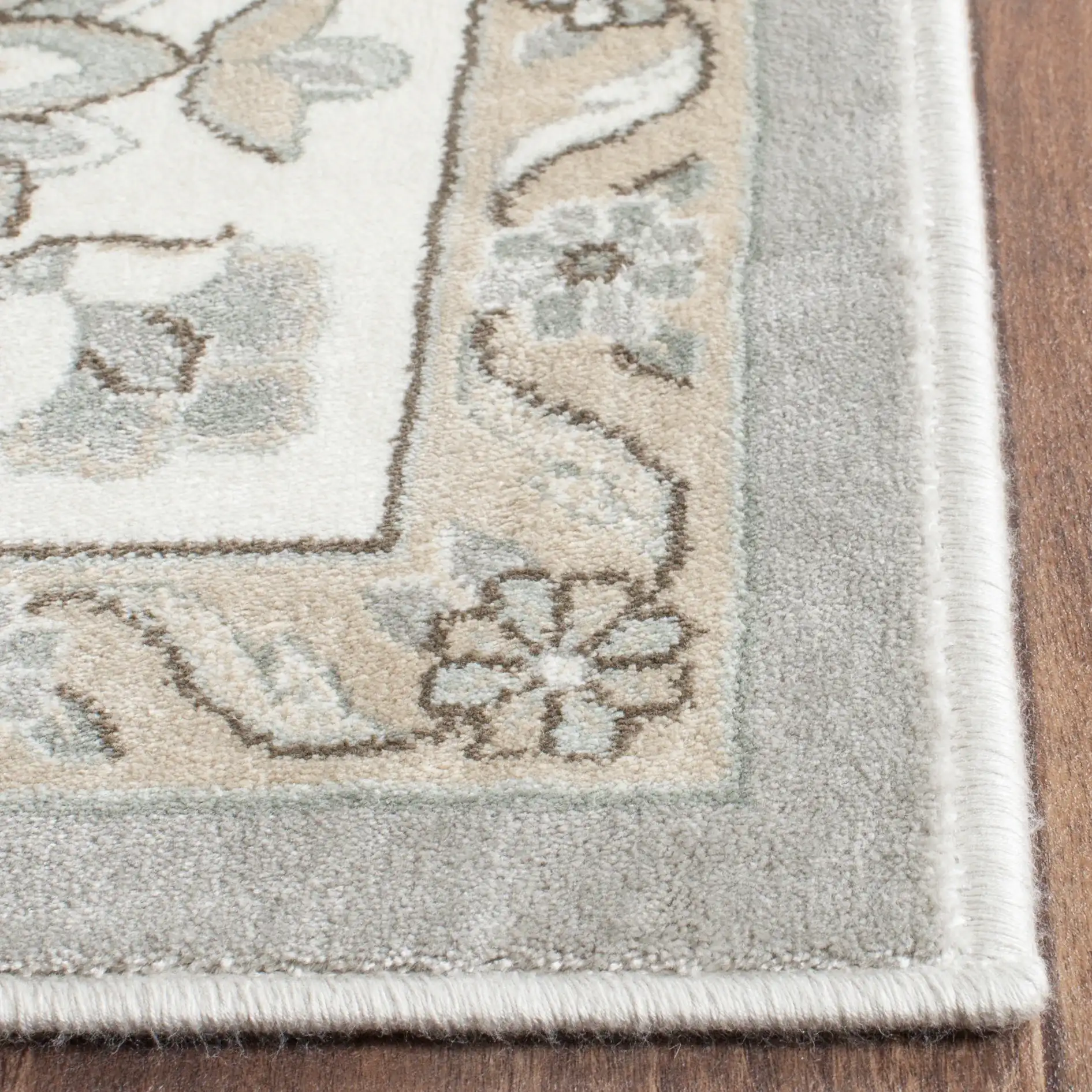 Persian Garden Floral Vine Viscose Rug in Silver / Ivory in a styled room