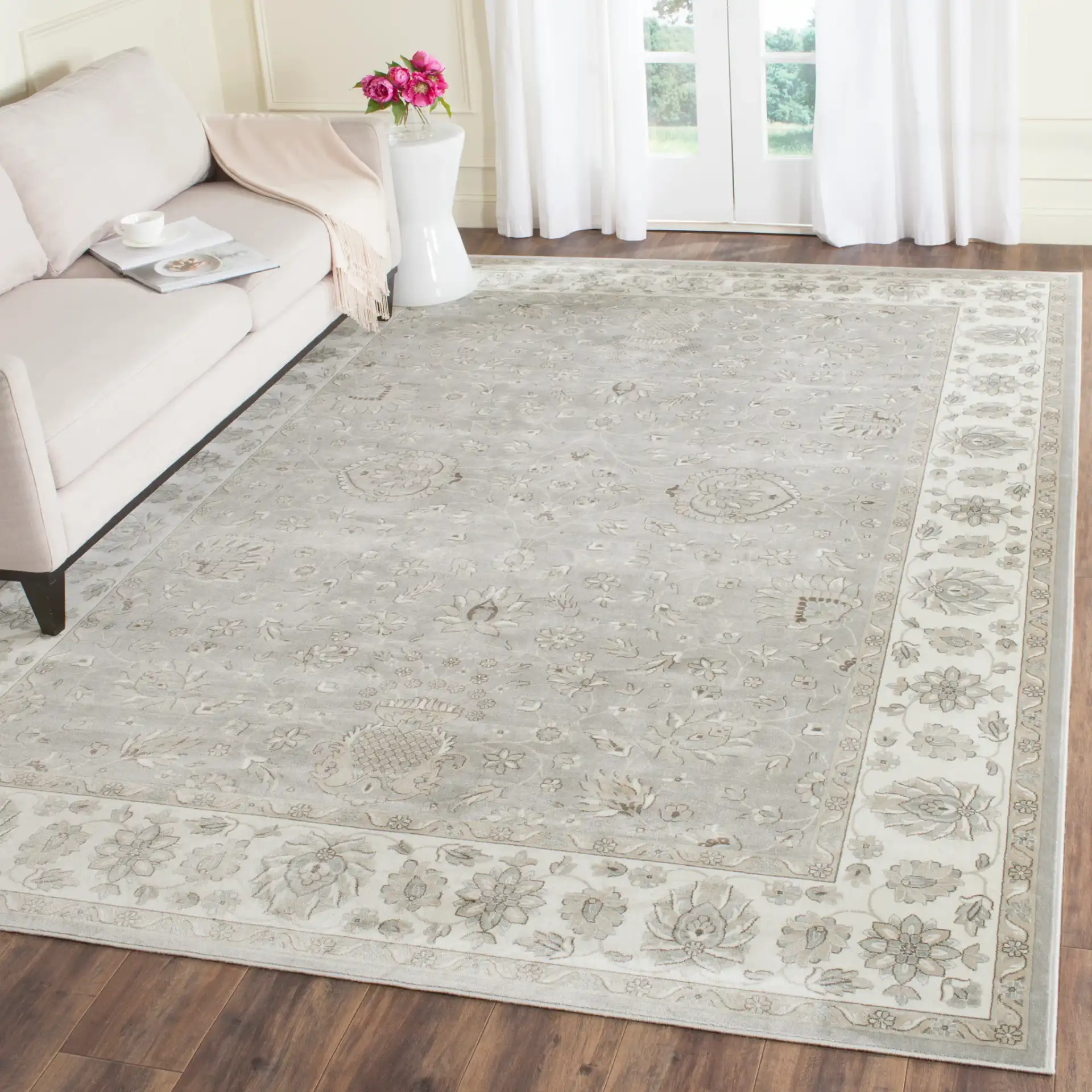 Persian Garden Floral Vine Viscose Rug in Silver / Ivory in a styled room