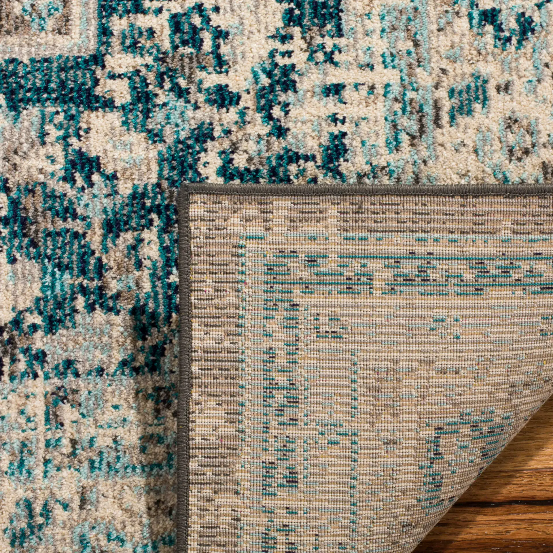Phoenix Distressed Geometric Medallion Rug in Gray / Blue in a styled room