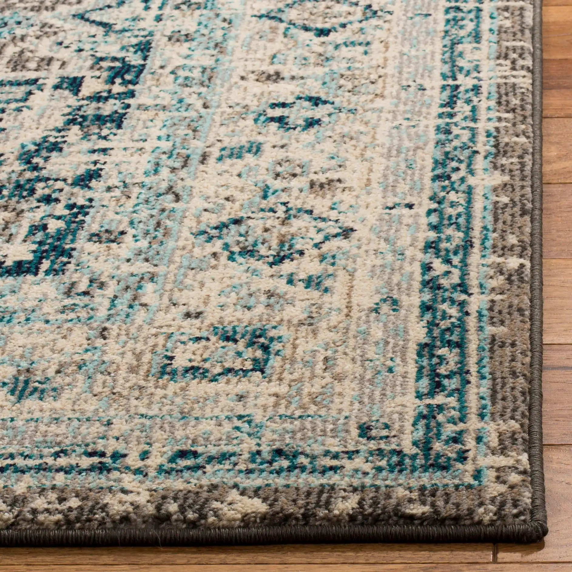 Phoenix Distressed Geometric Medallion Rug in Gray / Blue in a styled room