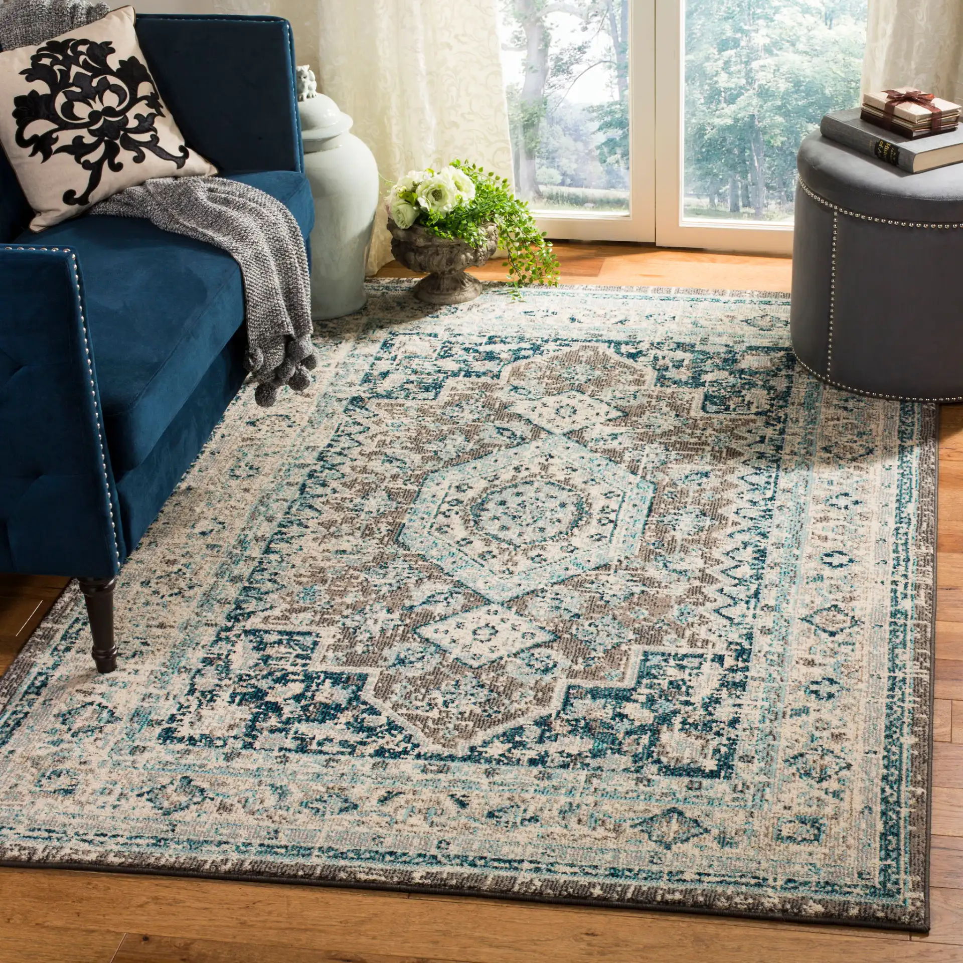 Phoenix Distressed Geometric Medallion Rug in Gray / Blue in a styled room