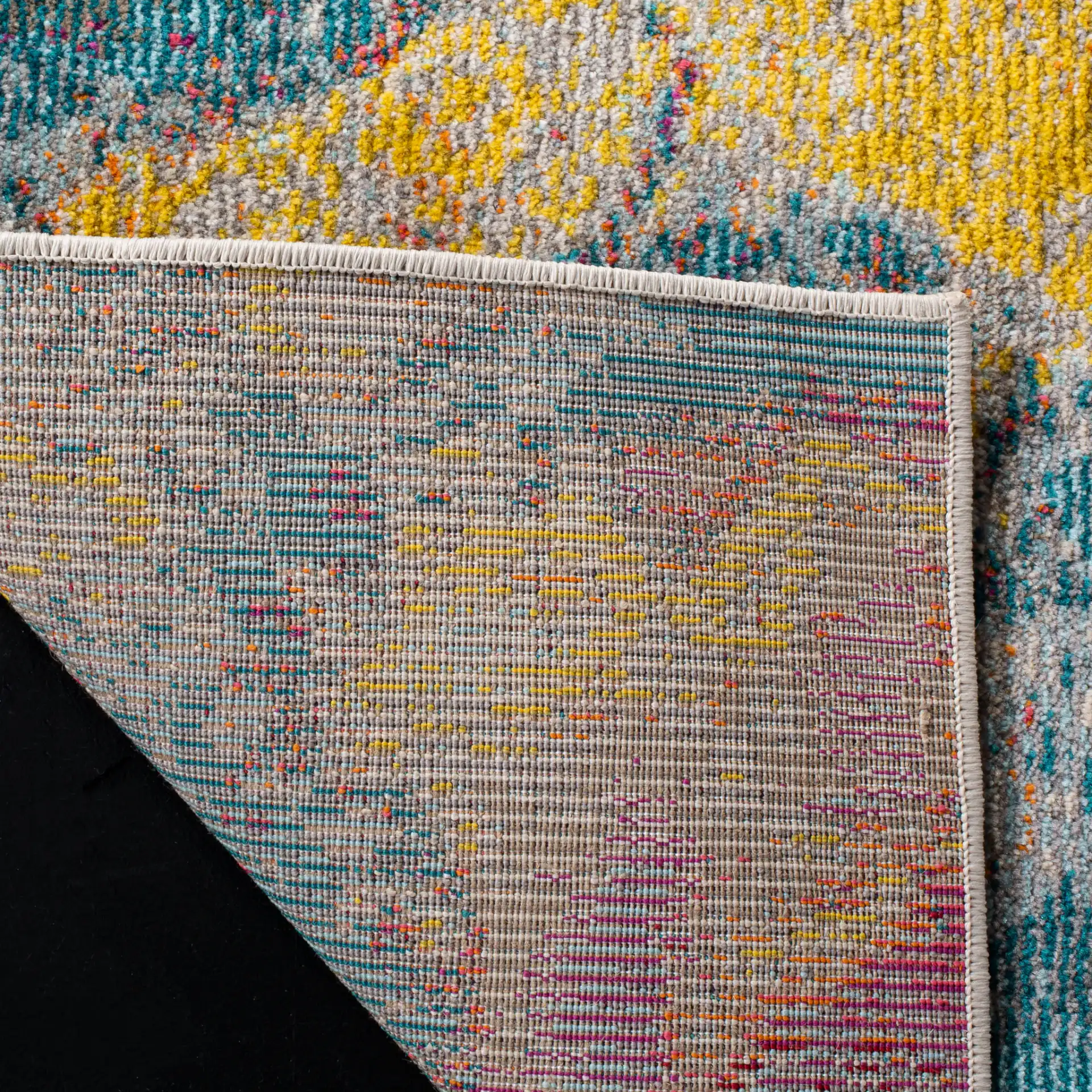 Phoenix Abstract Splatter Rug in Blue / Orange in a styled room