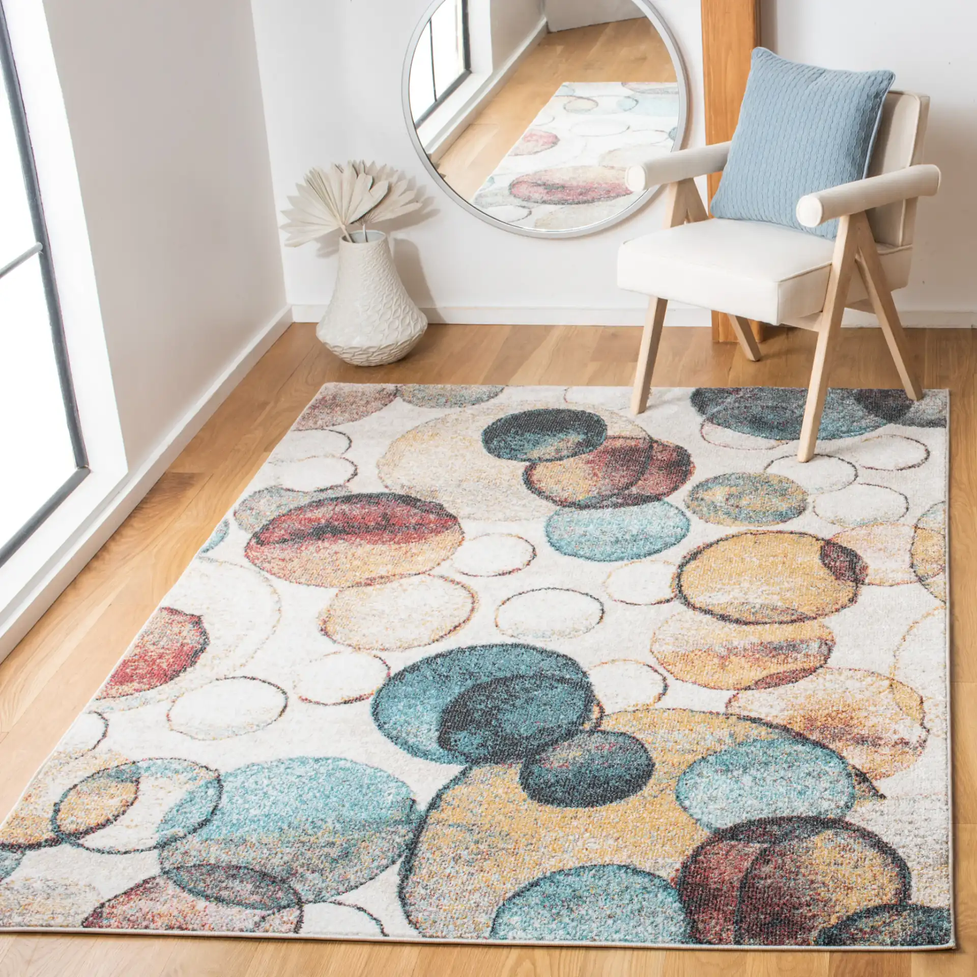 Phoenix Overlapping Circles Rug in Ivory / Rust in a styled room