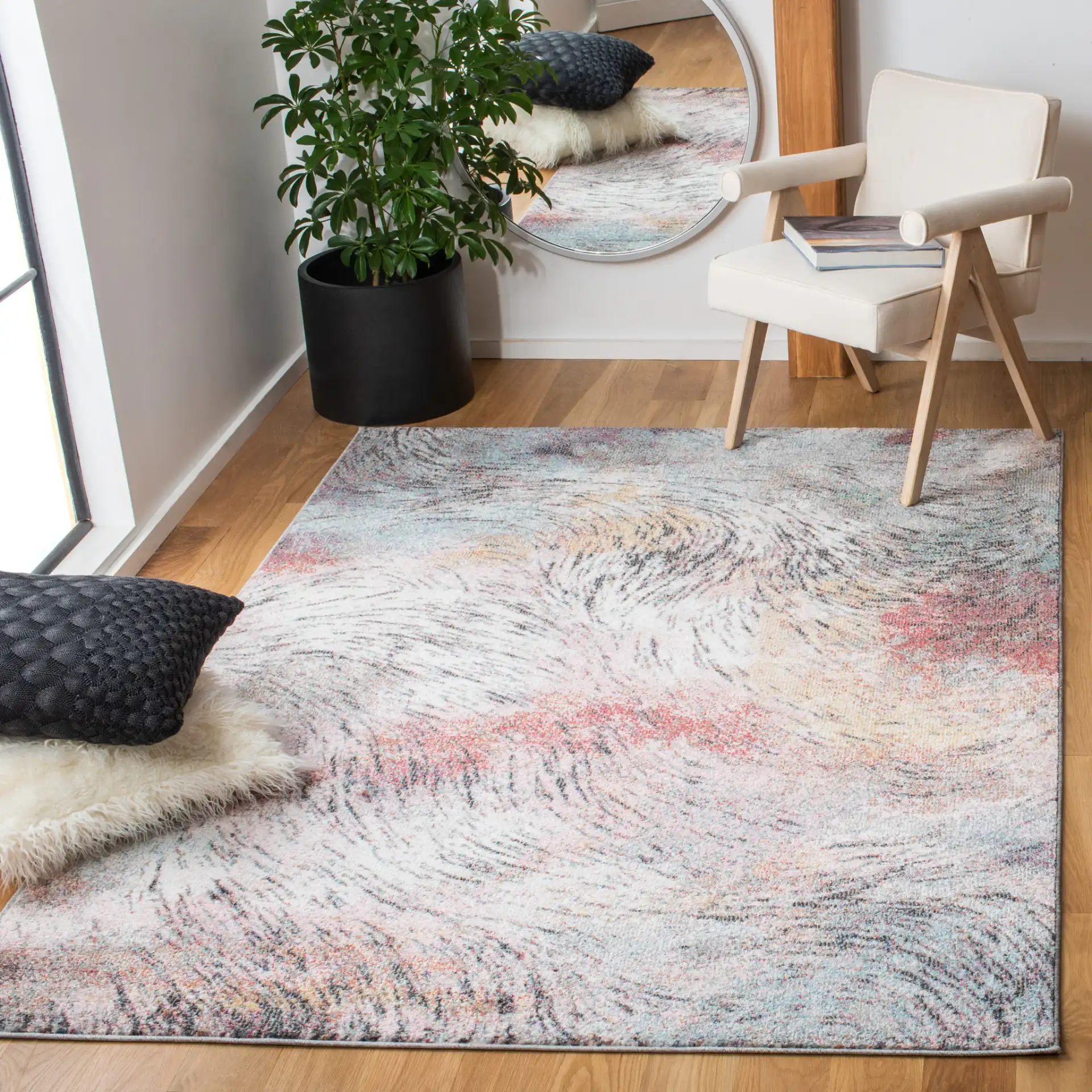Phoenix Swirling Wave Rug in Ivory / Pink in a styled room