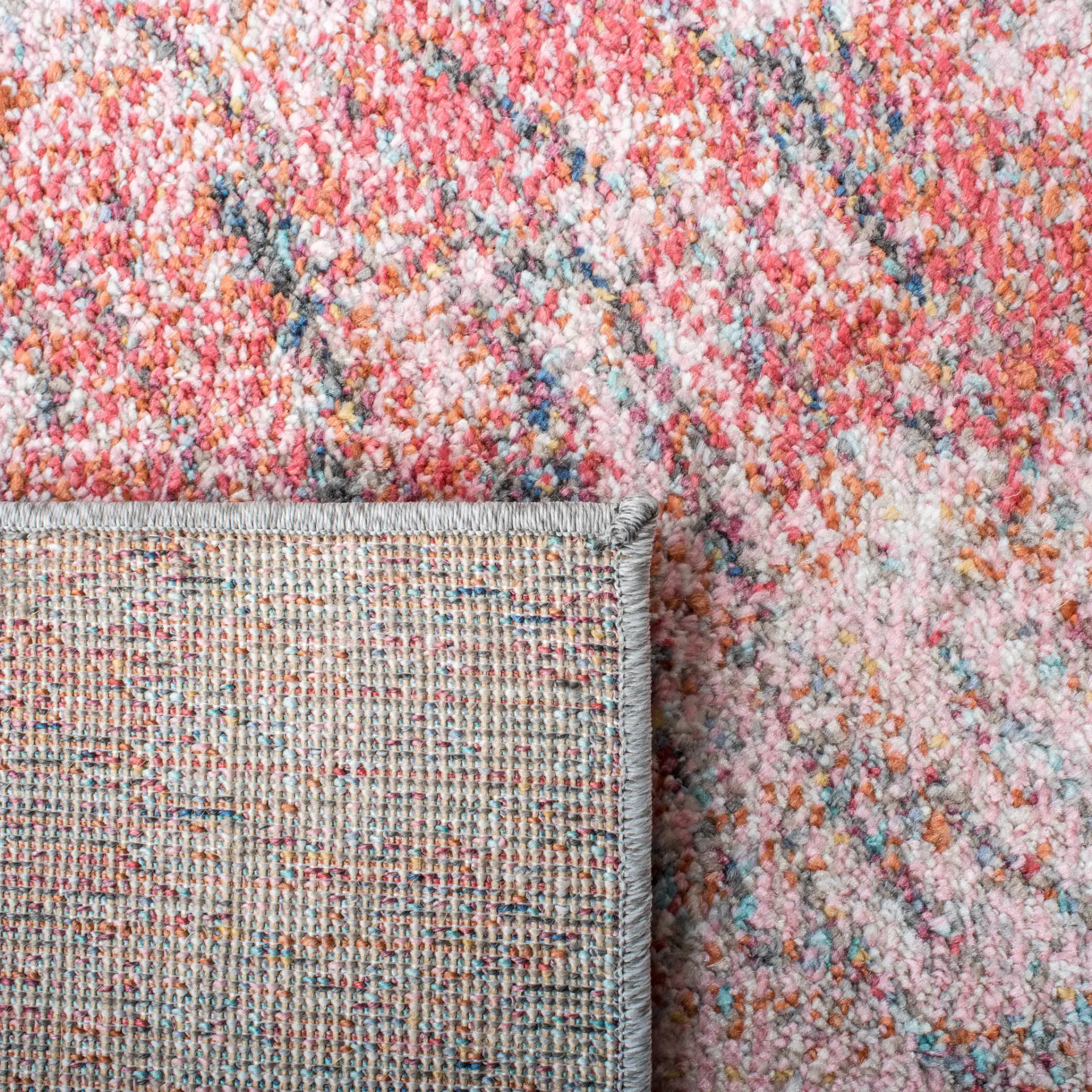 Phoenix Swirling Wave Rug in Ivory / Pink in a styled room