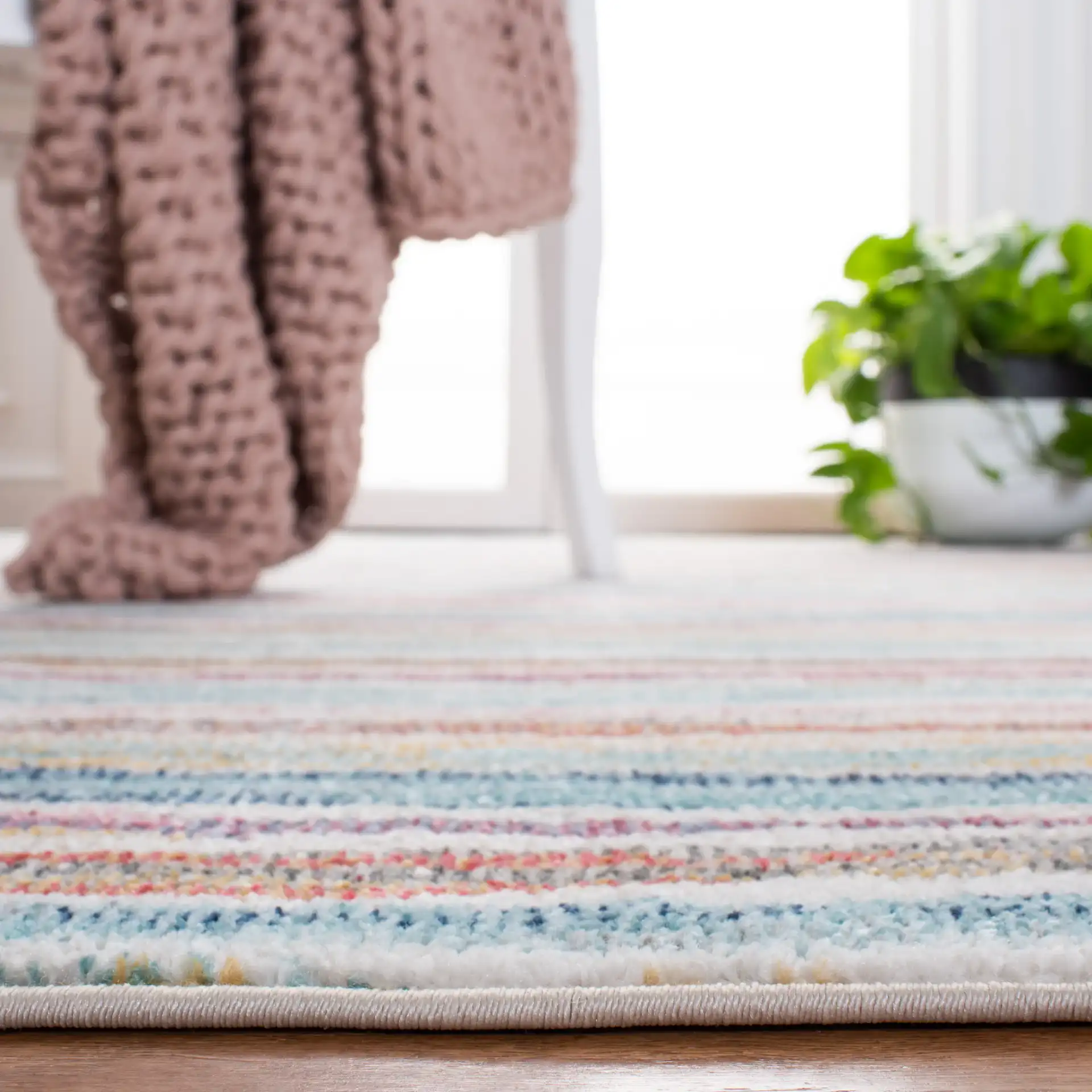 Phoenix Painterly Stripe Rug in Ivory / Blue in a styled room
