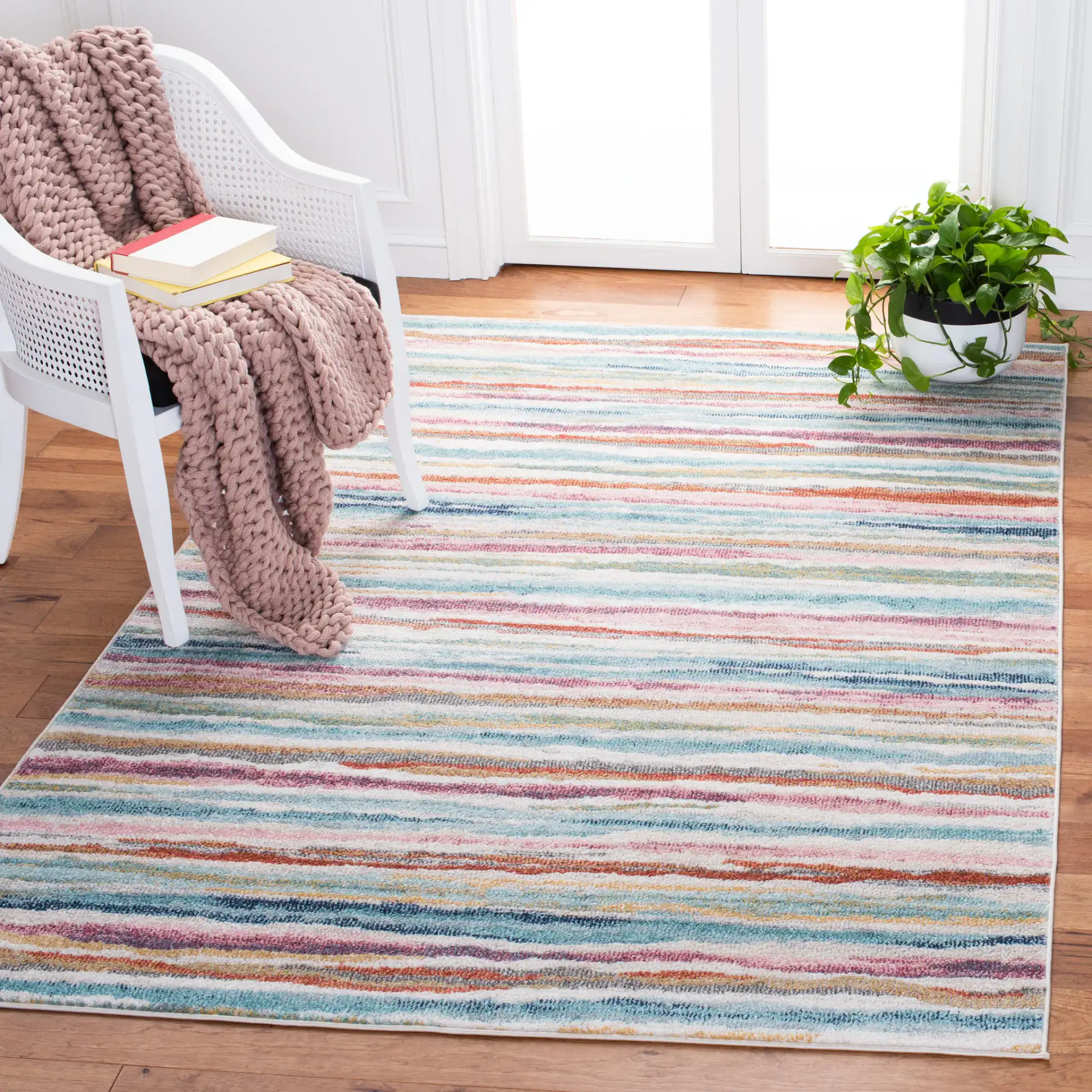Phoenix Painterly Stripe Rug in Ivory / Blue in a styled room
