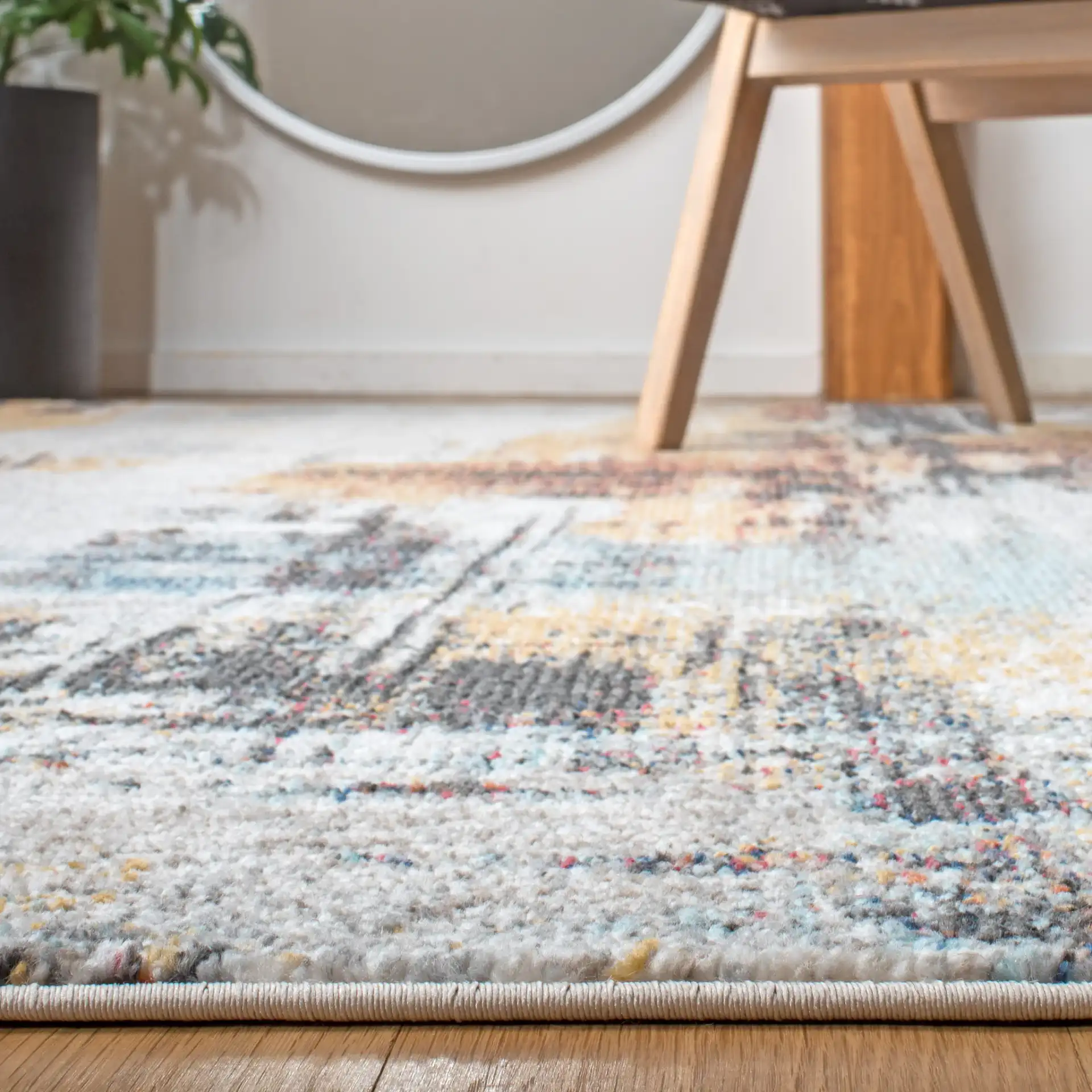 Phoenix Abstract Brushstroke Rug in Ivory / Gray in a styled room