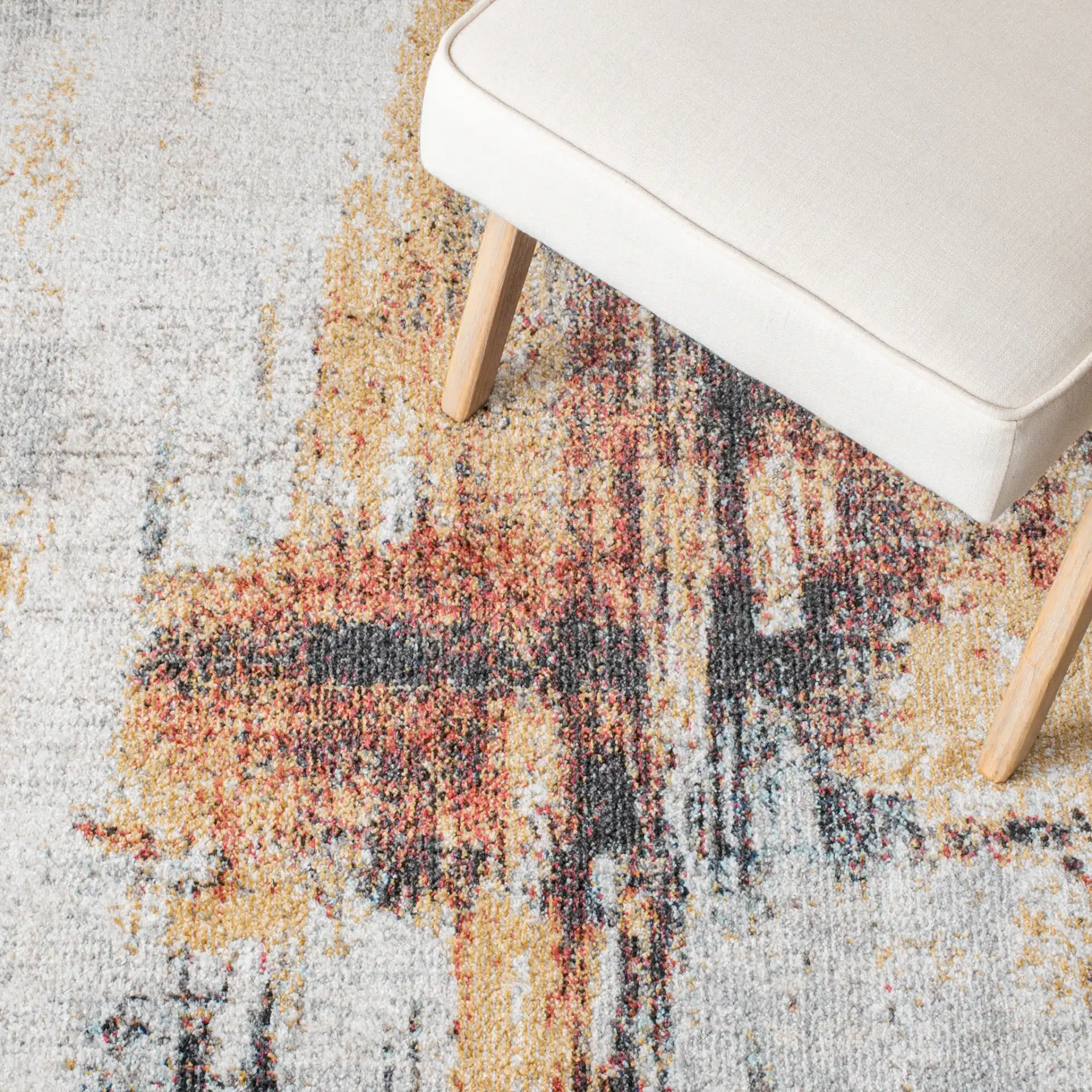 Phoenix Abstract Brushstroke Rug in Ivory / Gray in a styled room