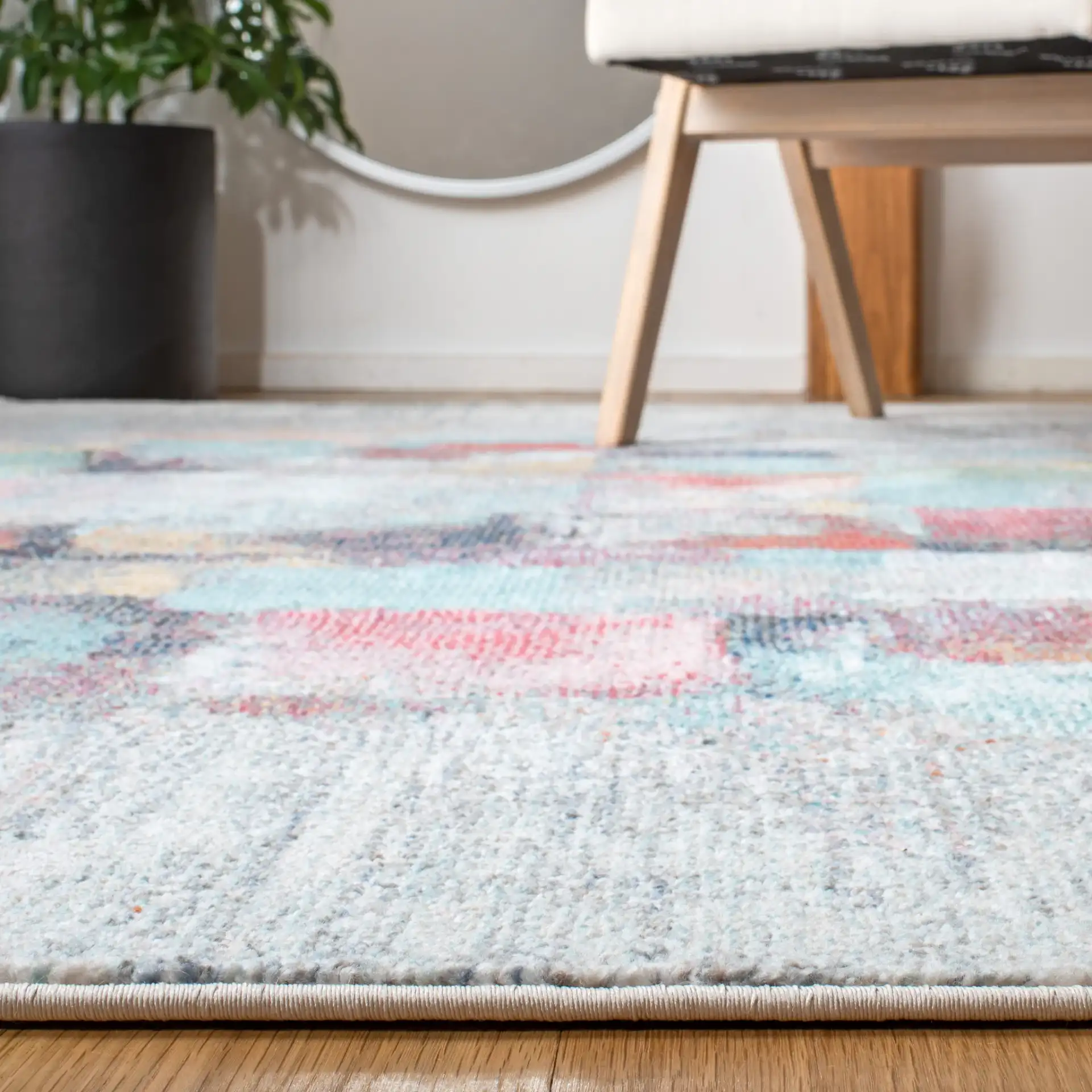 Phoenix Abstract Block Rug in Ivory / Gray in a styled room