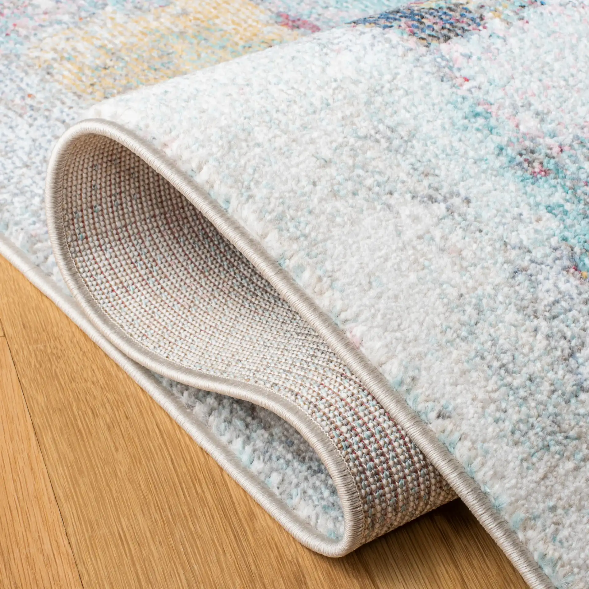Phoenix Abstract Block Rug in Ivory / Gray in a styled room
