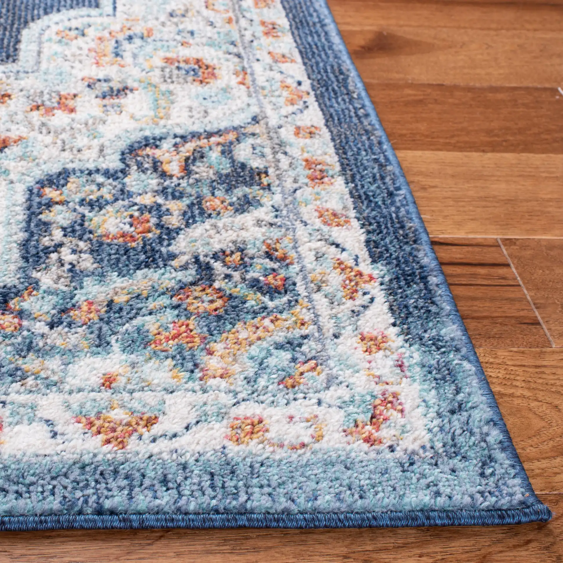 Phoenix Medallion Rug in Navy / Ivory in a styled room