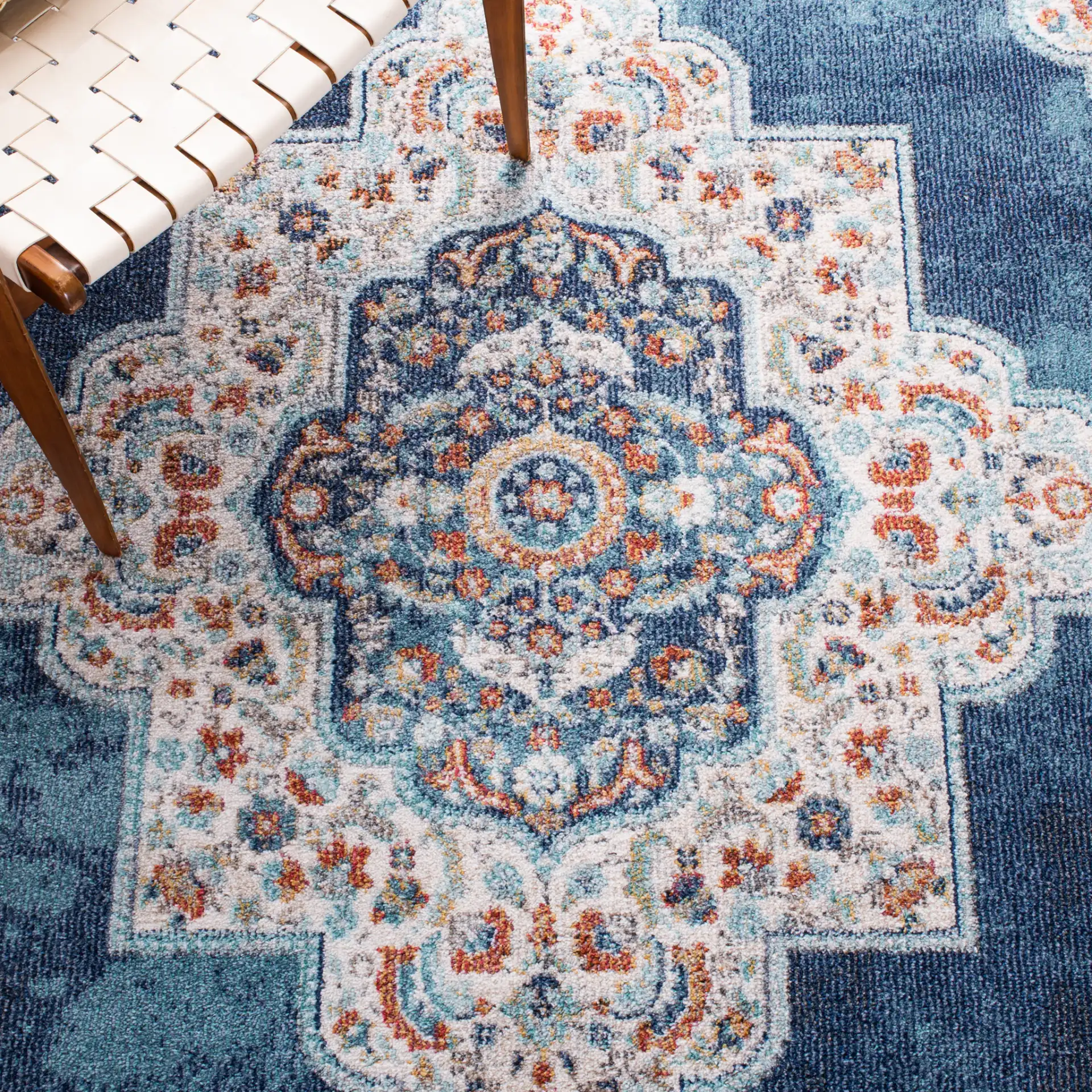 Phoenix Medallion Rug in Navy / Ivory in a styled room