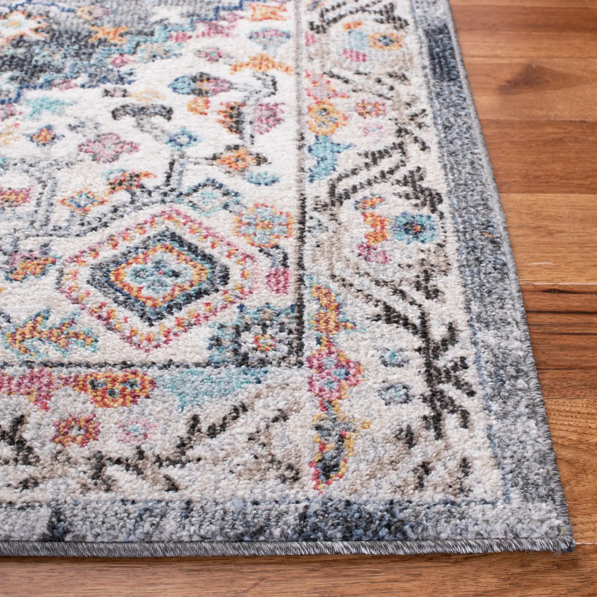 Phoenix Medallion Border Rug in Ivory / Gray in a styled room