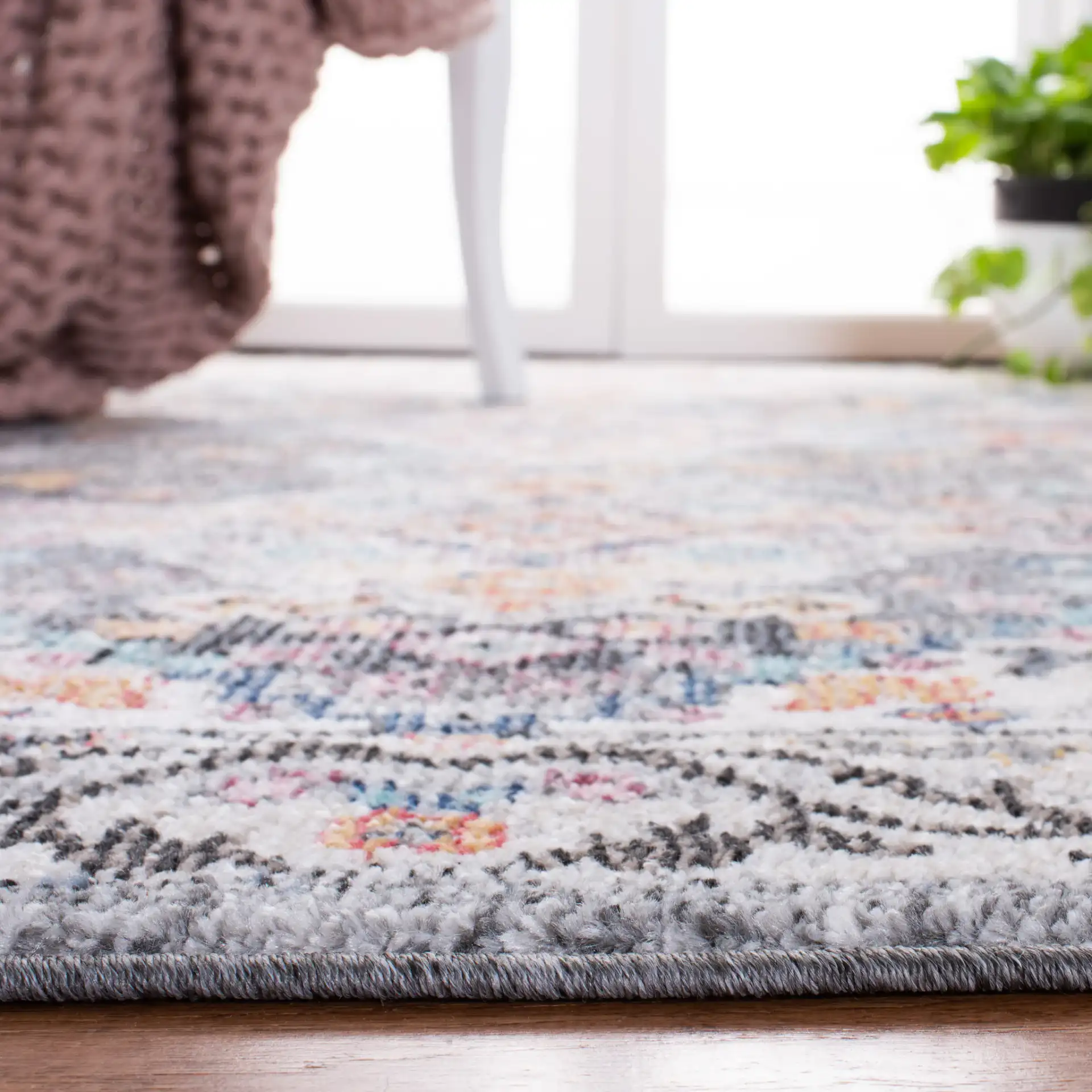 Phoenix Medallion Border Rug in Ivory / Gray in a styled room