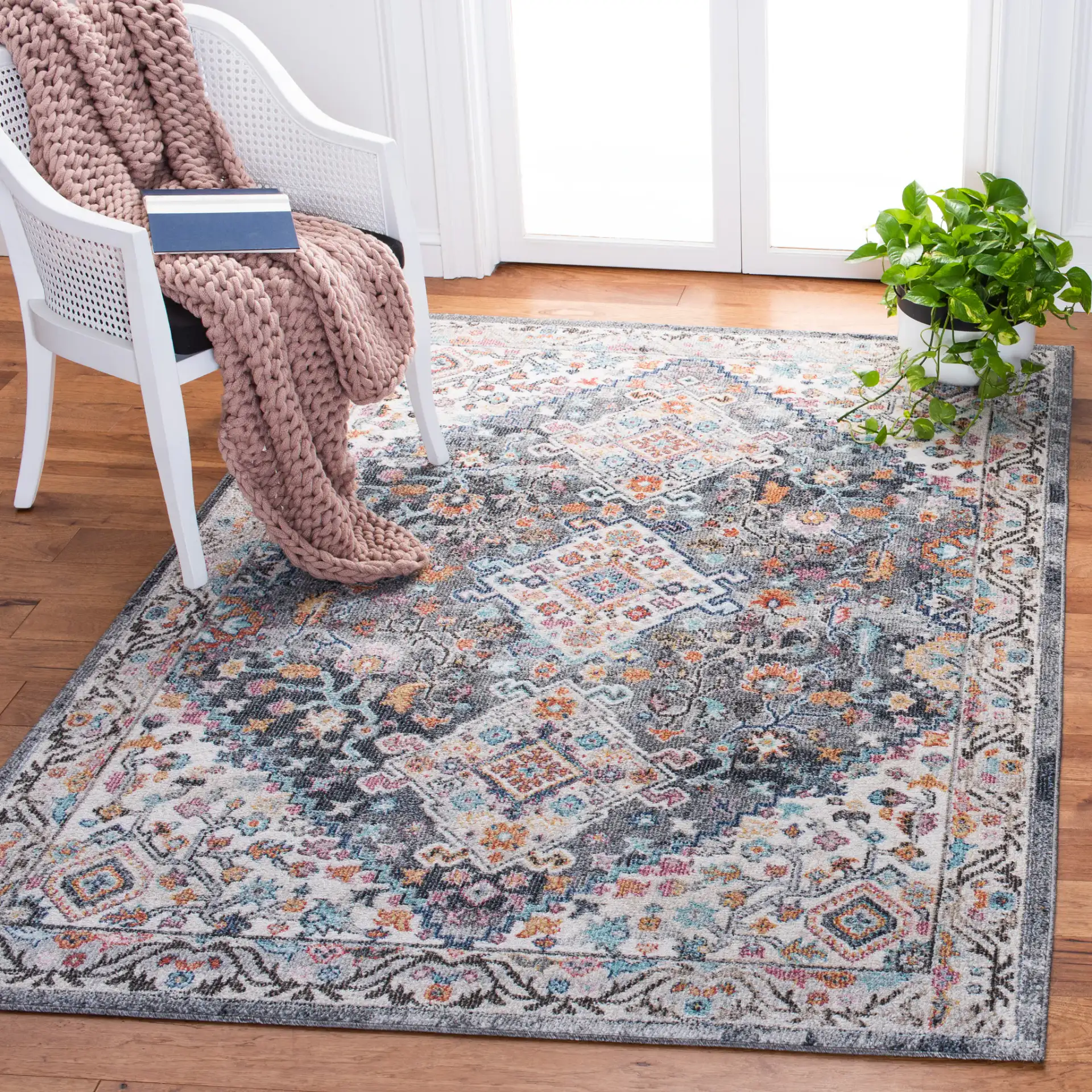 Phoenix Medallion Border Rug in Ivory / Gray in a styled room