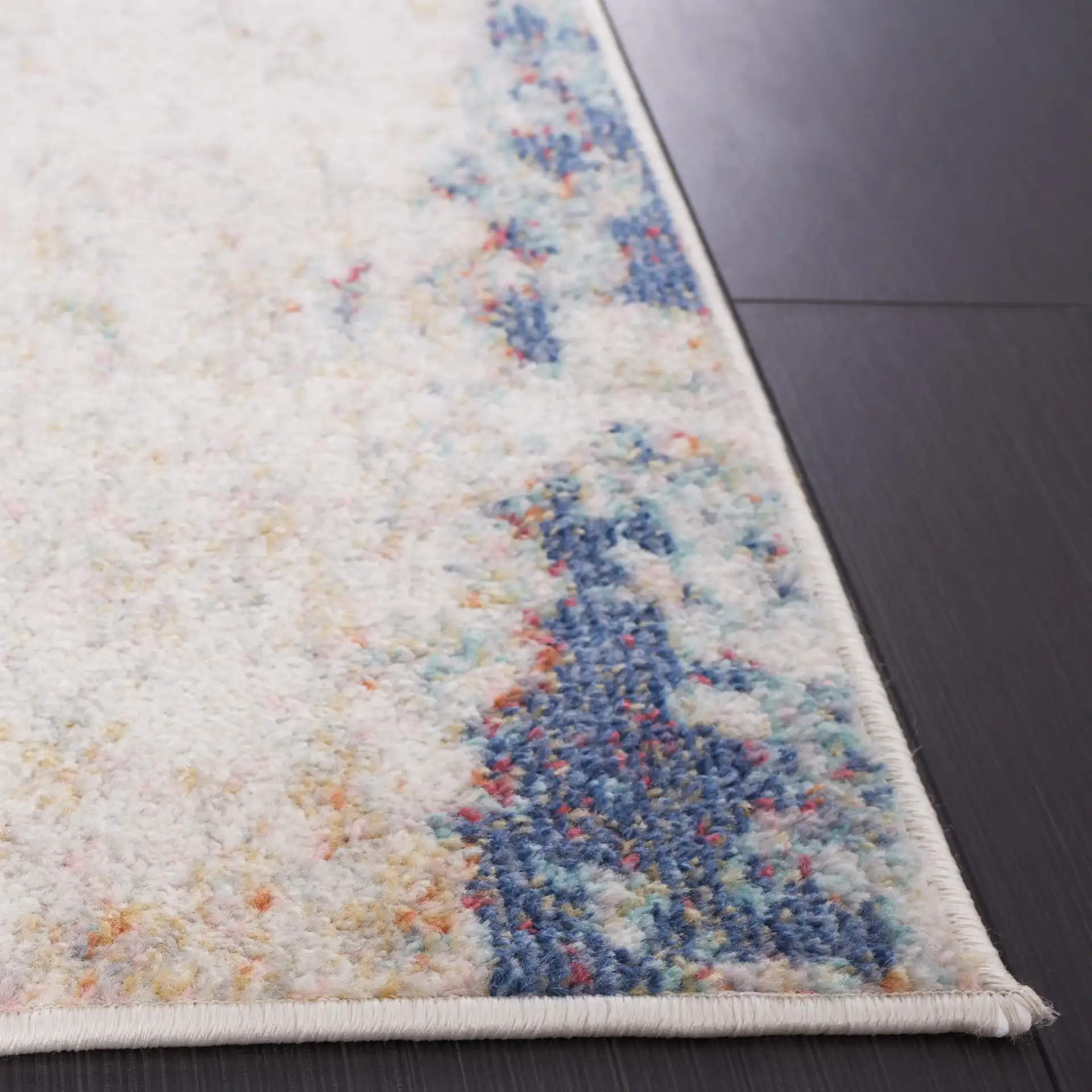 Phoenix Painterly Abstract Rug in Ivory / Blue Rust in a styled room