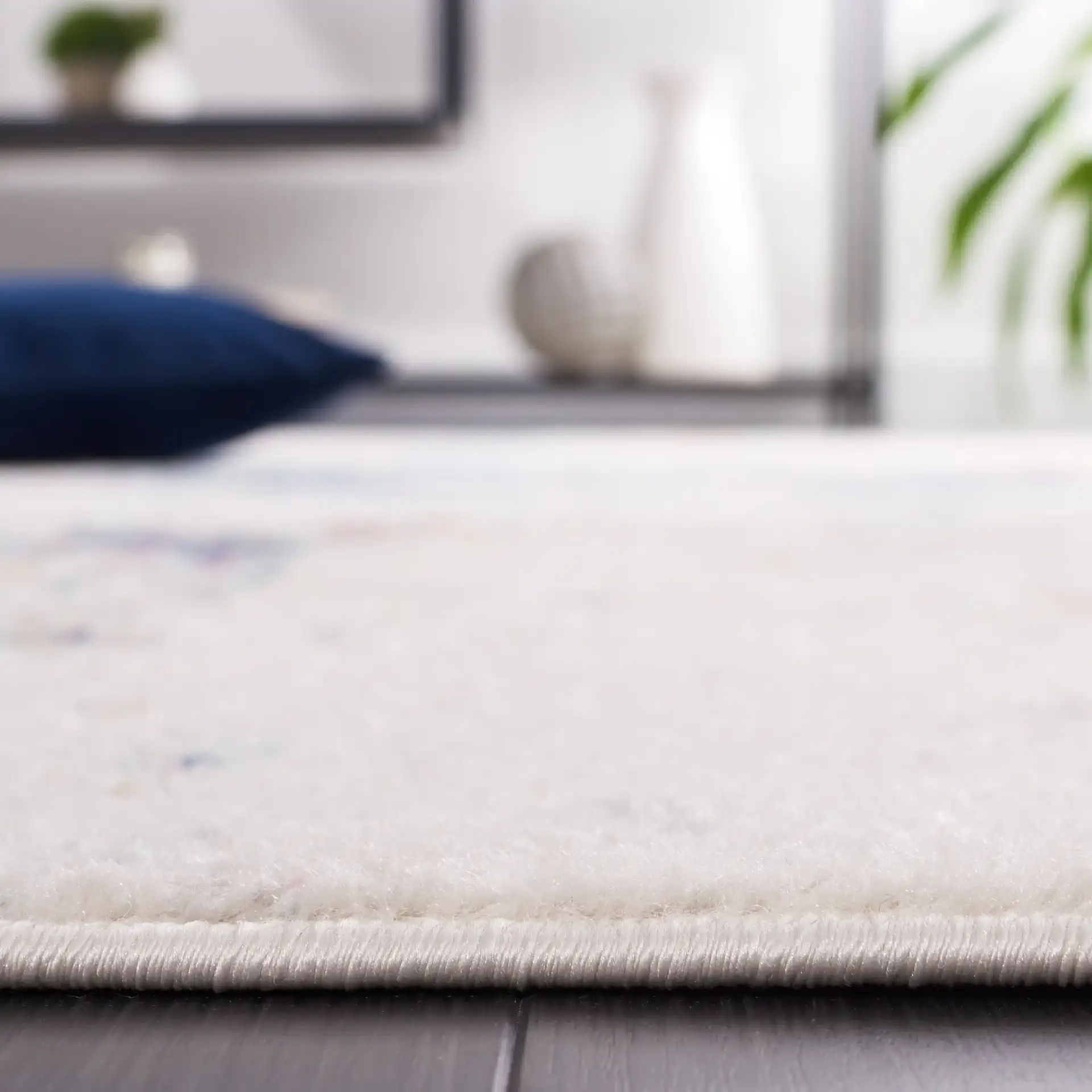 Phoenix Painterly Abstract Rug in Ivory / Blue Rust in a styled room