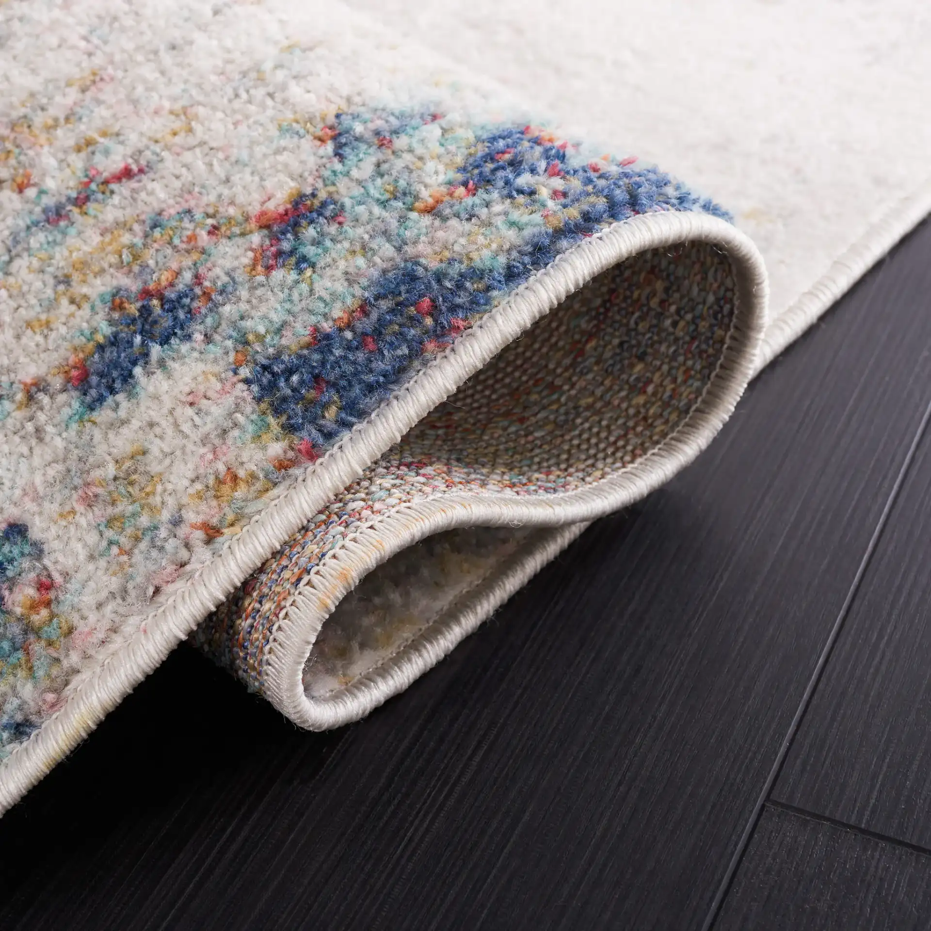 Phoenix Painterly Abstract Rug in Ivory / Blue Rust in a styled room