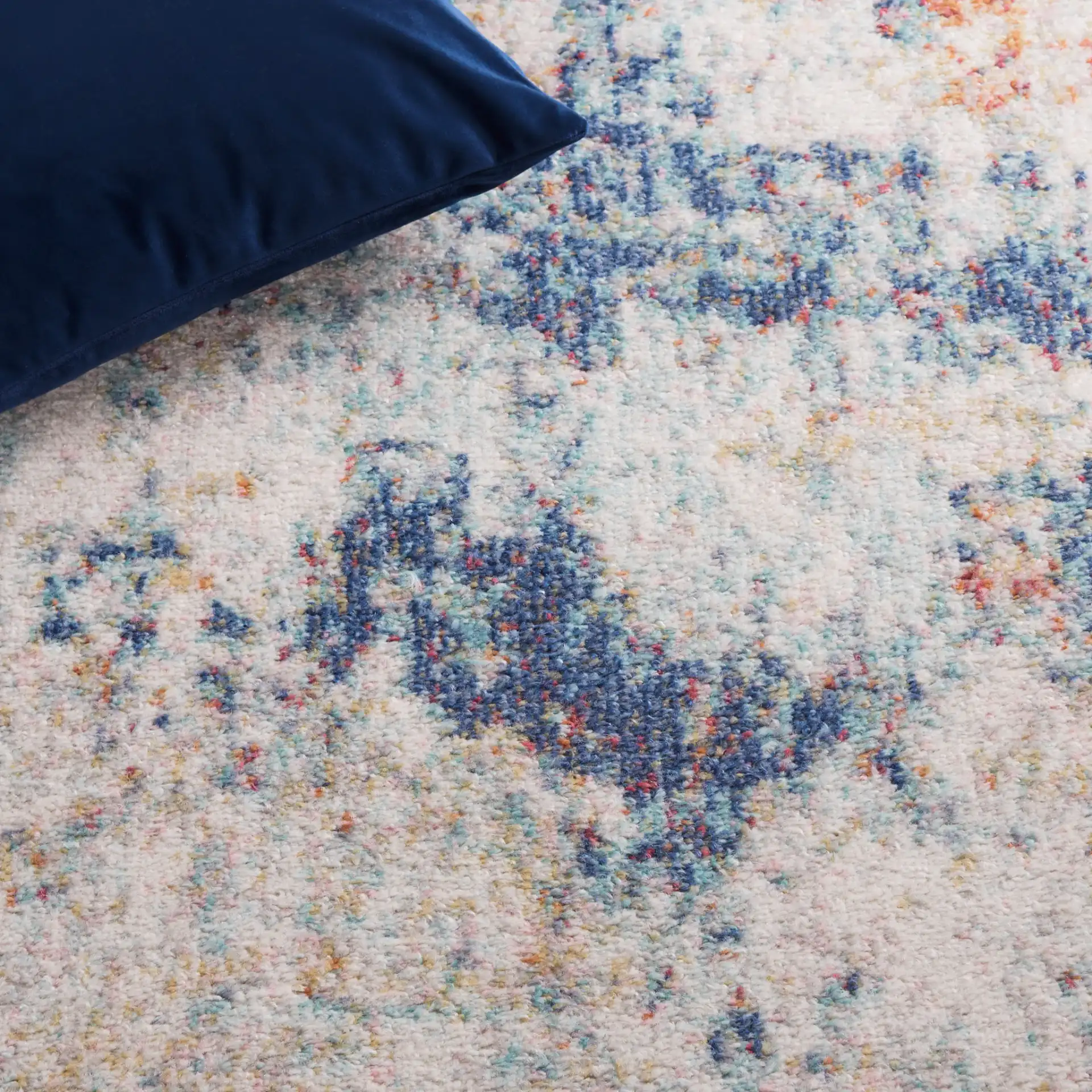 Phoenix Painterly Abstract Rug in Ivory / Blue Rust in a styled room
