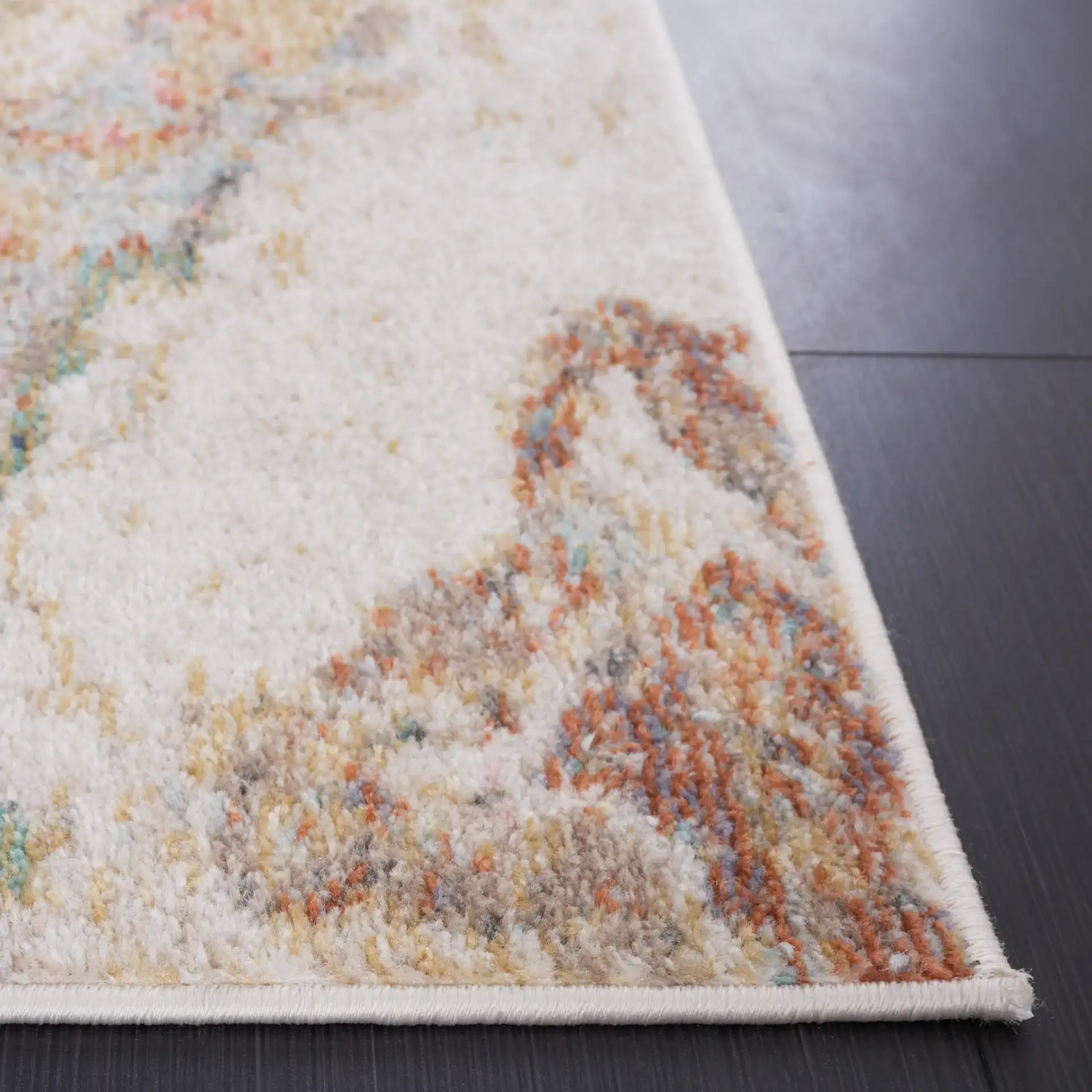 Phoenix Swirling Abstract Rug in Ivory / Gold Rust in a styled room