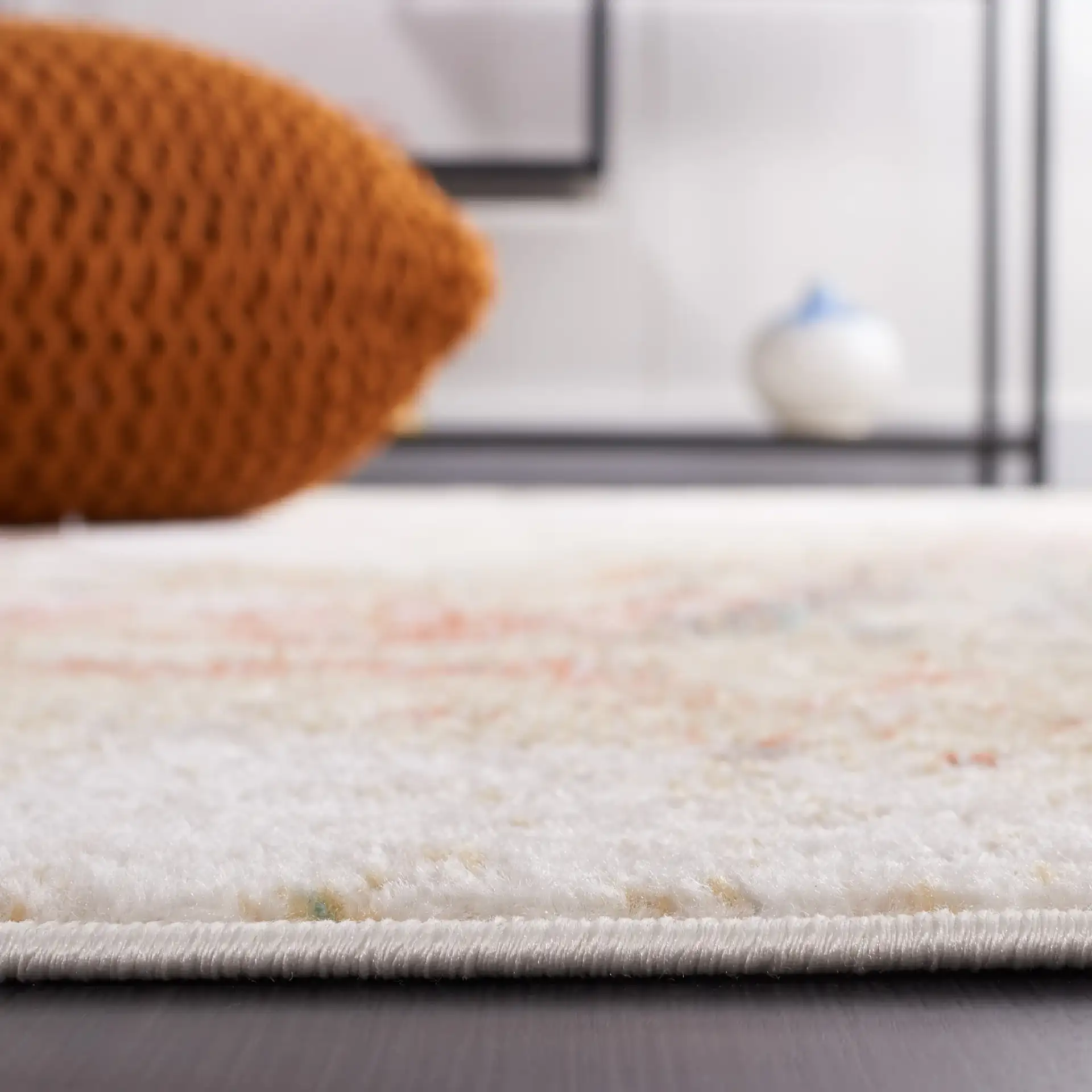 Phoenix Swirling Abstract Rug in Ivory / Gold Rust in a styled room