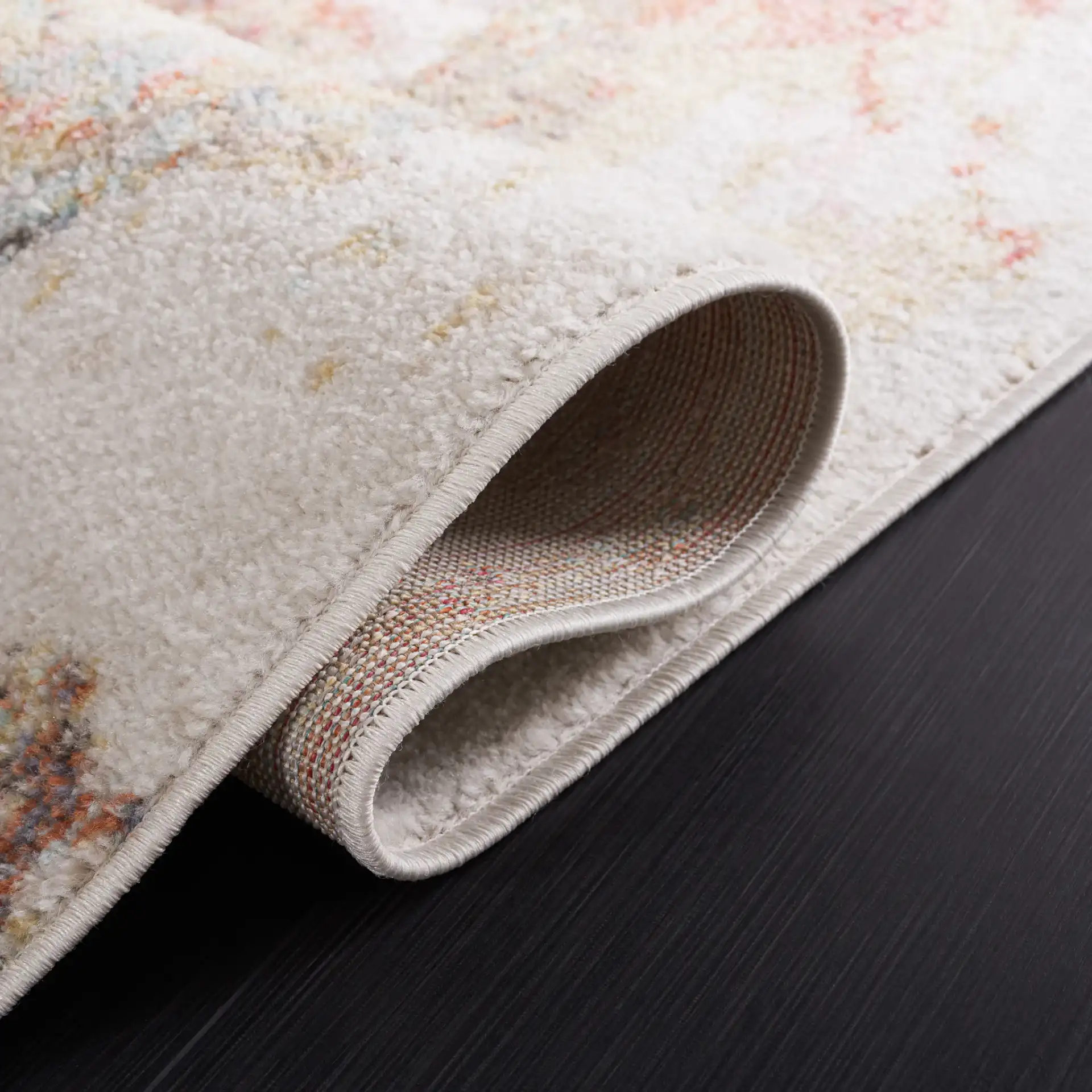 Phoenix Swirling Abstract Rug in Ivory / Gold Rust in a styled room