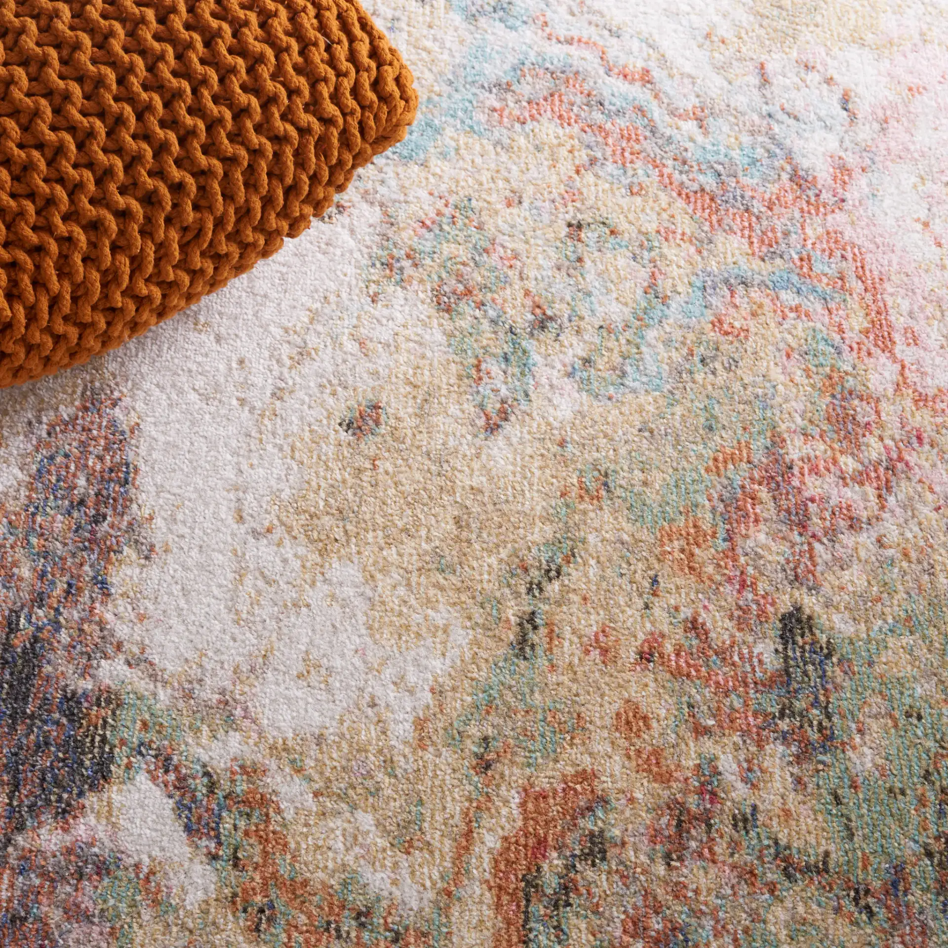 Phoenix Swirling Abstract Rug in Ivory / Gold Rust in a styled room