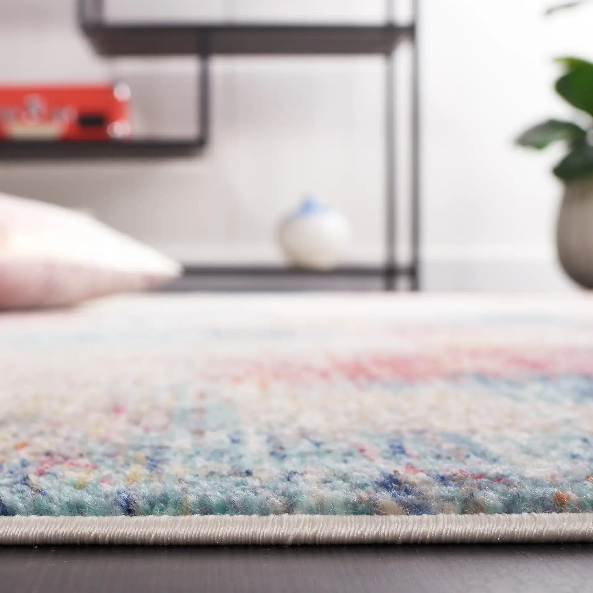 Phoenix Abstract Painterly Rug in Aqua / Gold Rose in a styled room