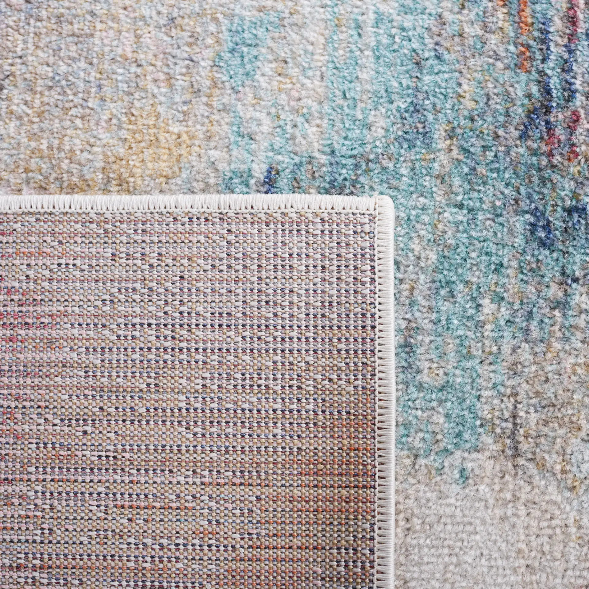 Phoenix Abstract Painterly Rug in Aqua / Gold Rose in a styled room