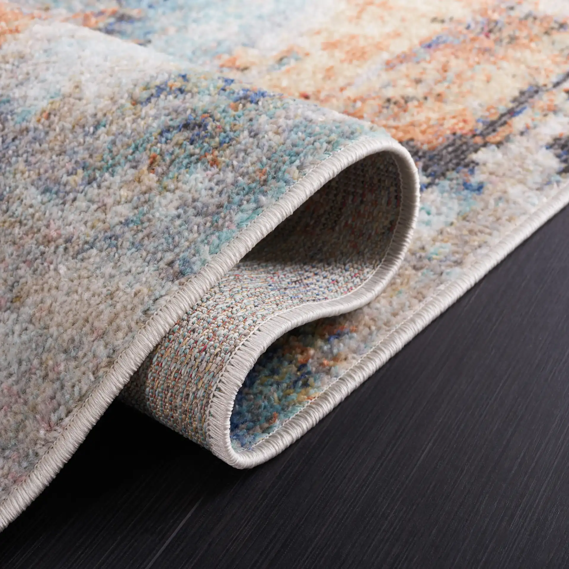 Phoenix Abstract Rug in Aqua / Gold Rust in a styled room
