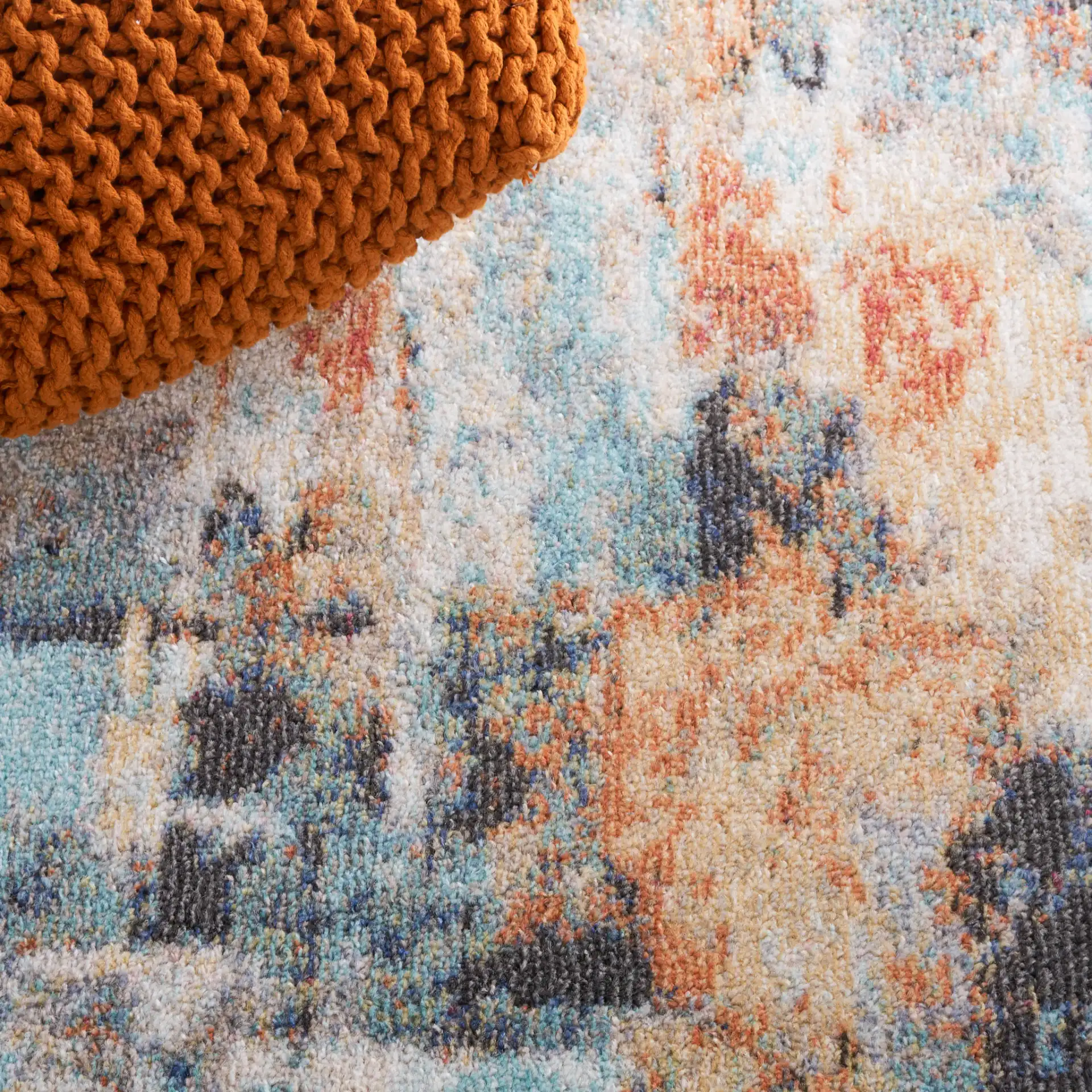 Phoenix Abstract Rug in Aqua / Gold Rust in a styled room