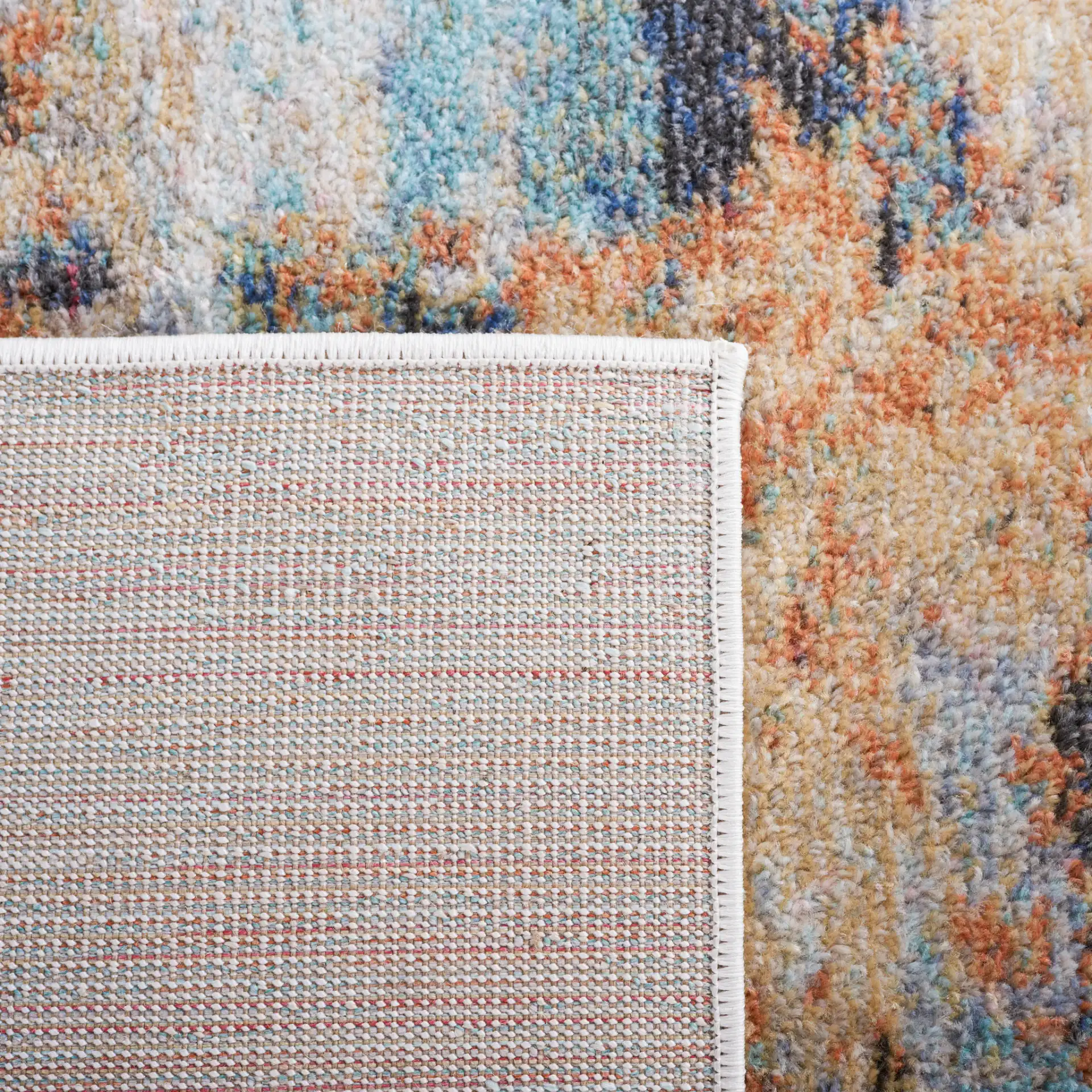 Phoenix Abstract Rug in Aqua / Gold Rust in a styled room