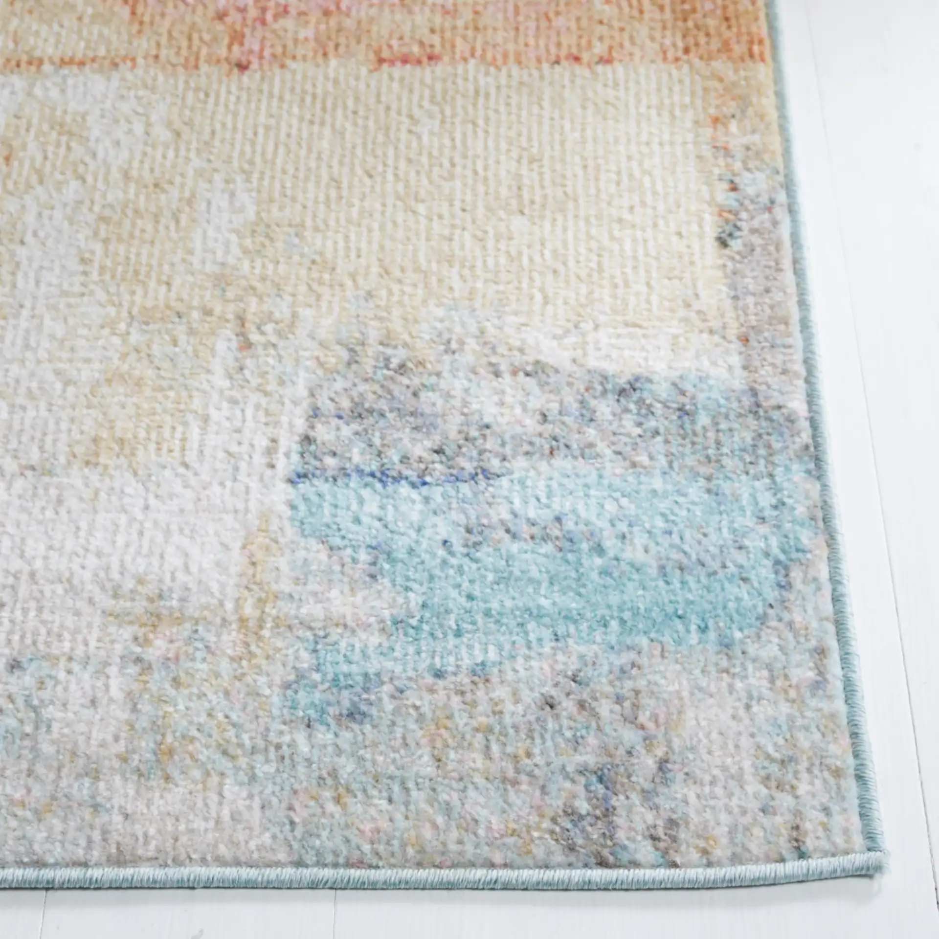 Phoenix Painterly Block Rug in Rust Blue / Ivory in a styled room