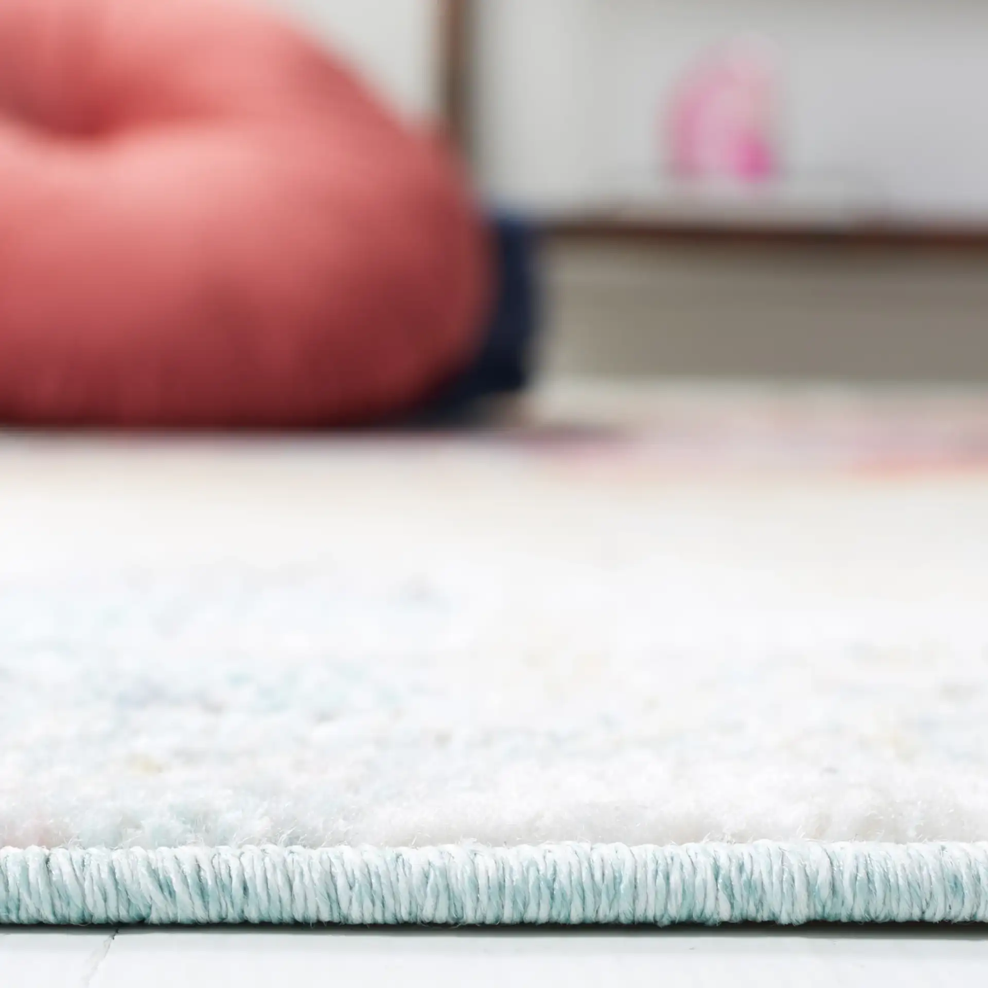 Phoenix Painterly Block Rug in Rust Blue / Ivory in a styled room
