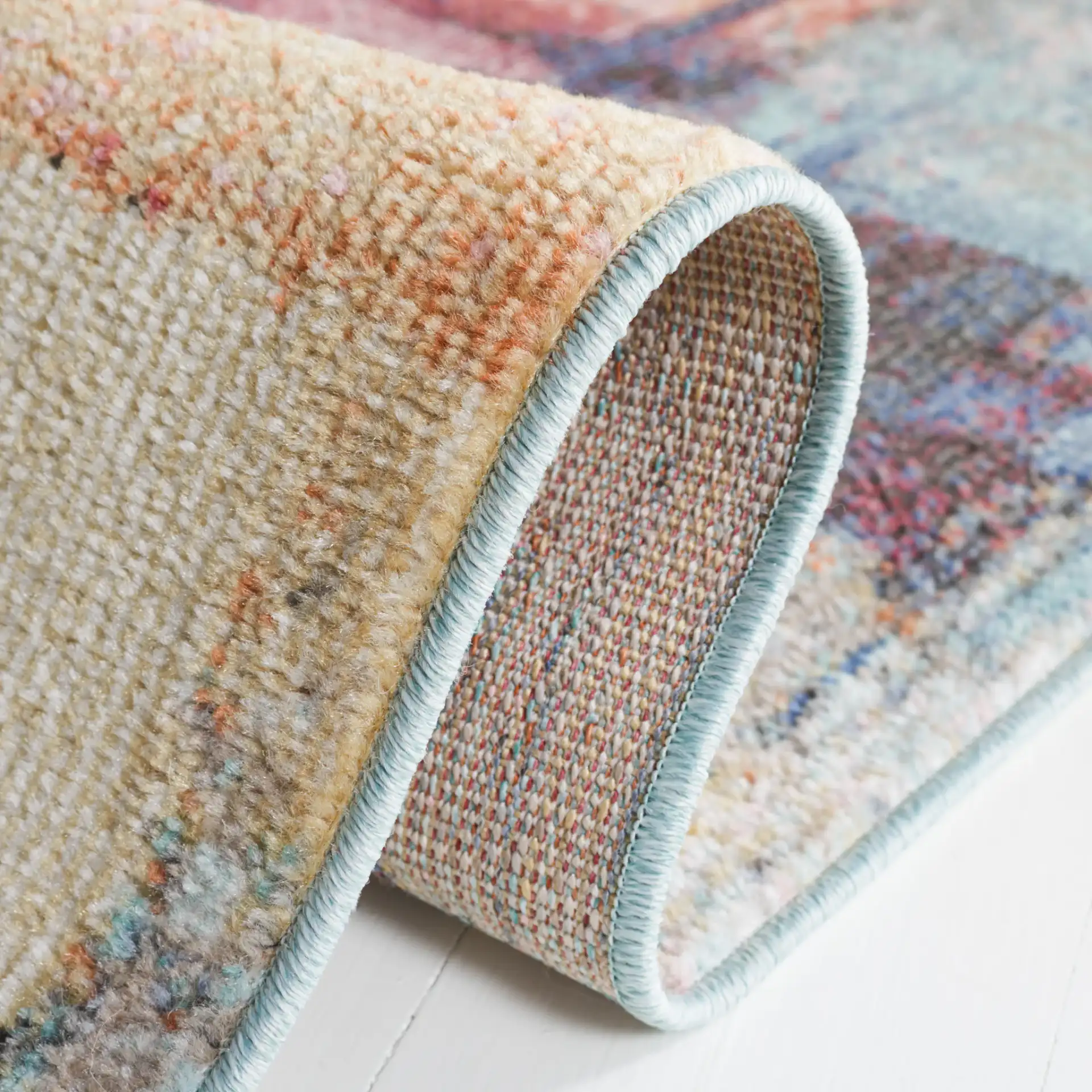 Phoenix Painterly Block Rug in Rust Blue / Ivory in a styled room