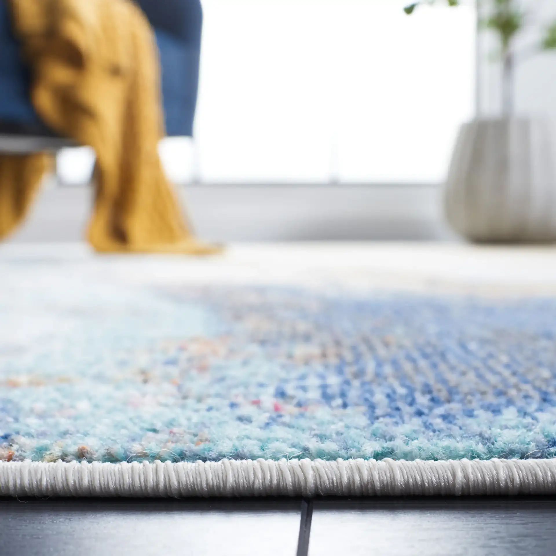 Phoenix Abstract Marble Rug in Blue in a styled room