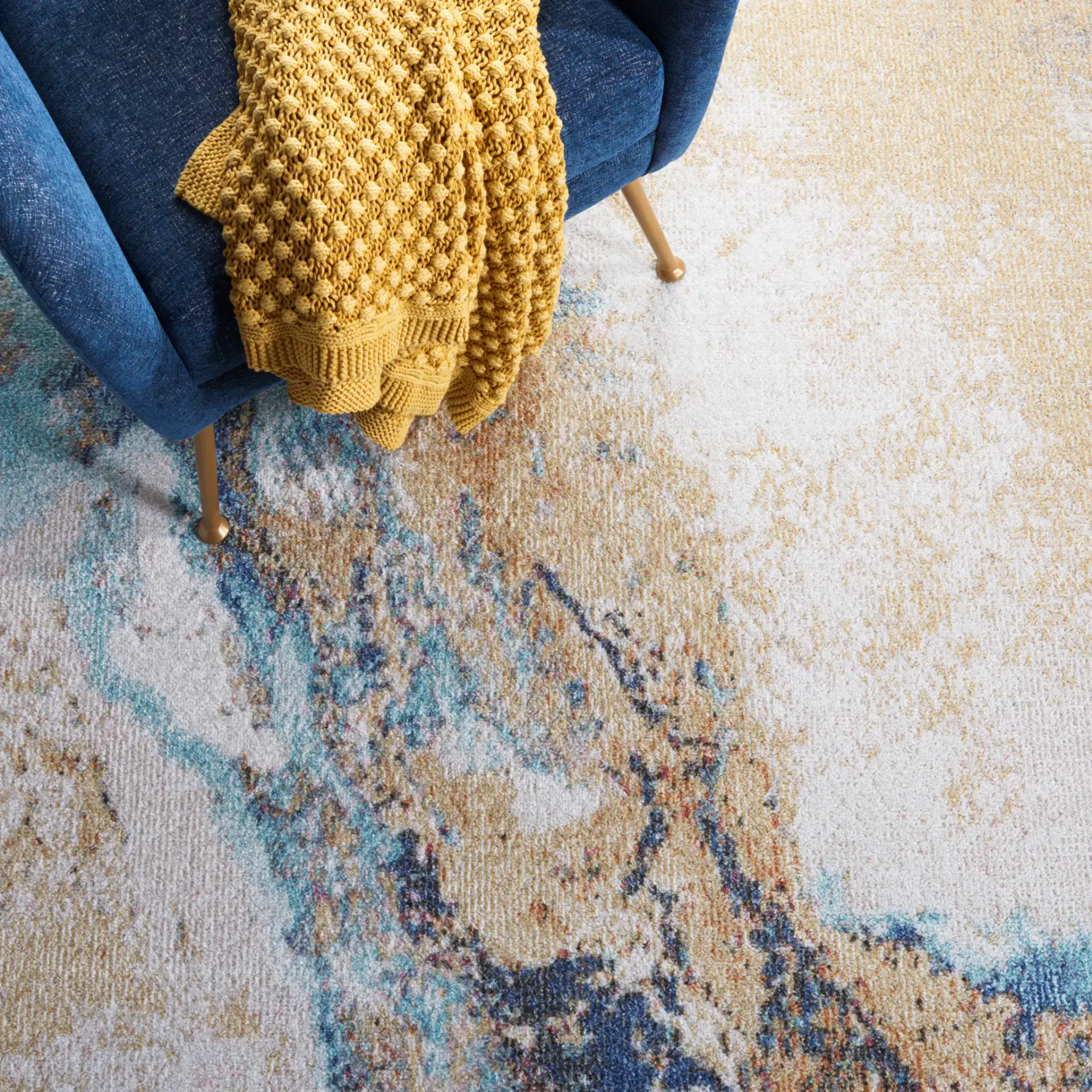 Phoenix Abstract Marble Rug in Blue in a styled room