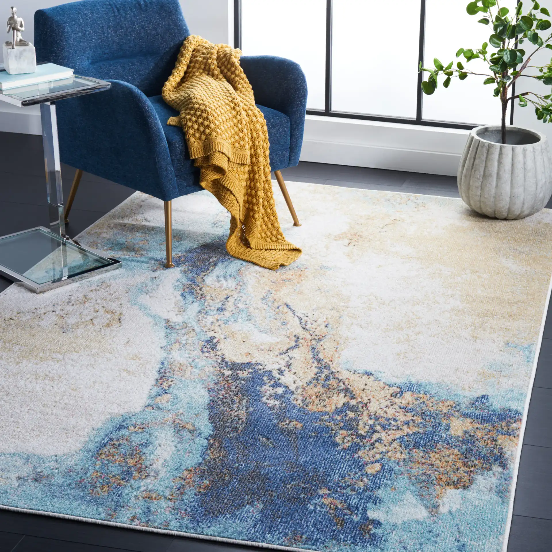 Phoenix Abstract Marble Rug in Blue in a styled room
