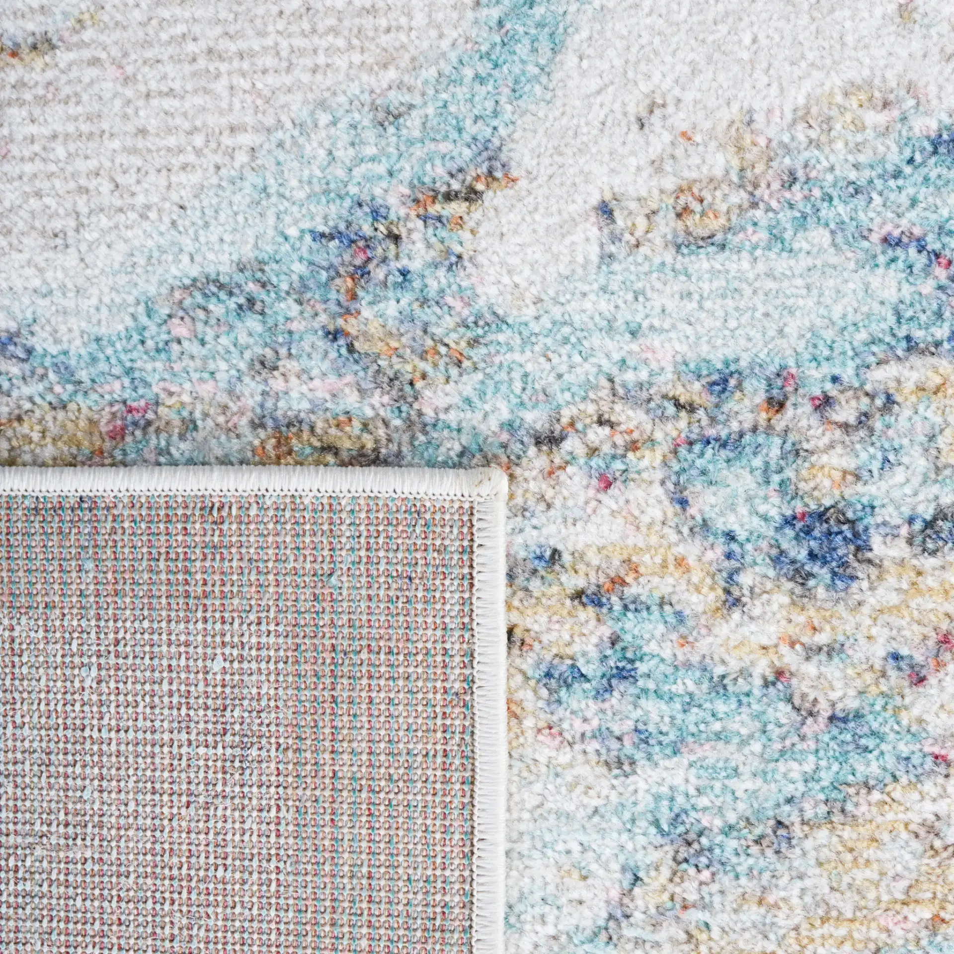 Phoenix Abstract Marble Rug in Blue in a styled room