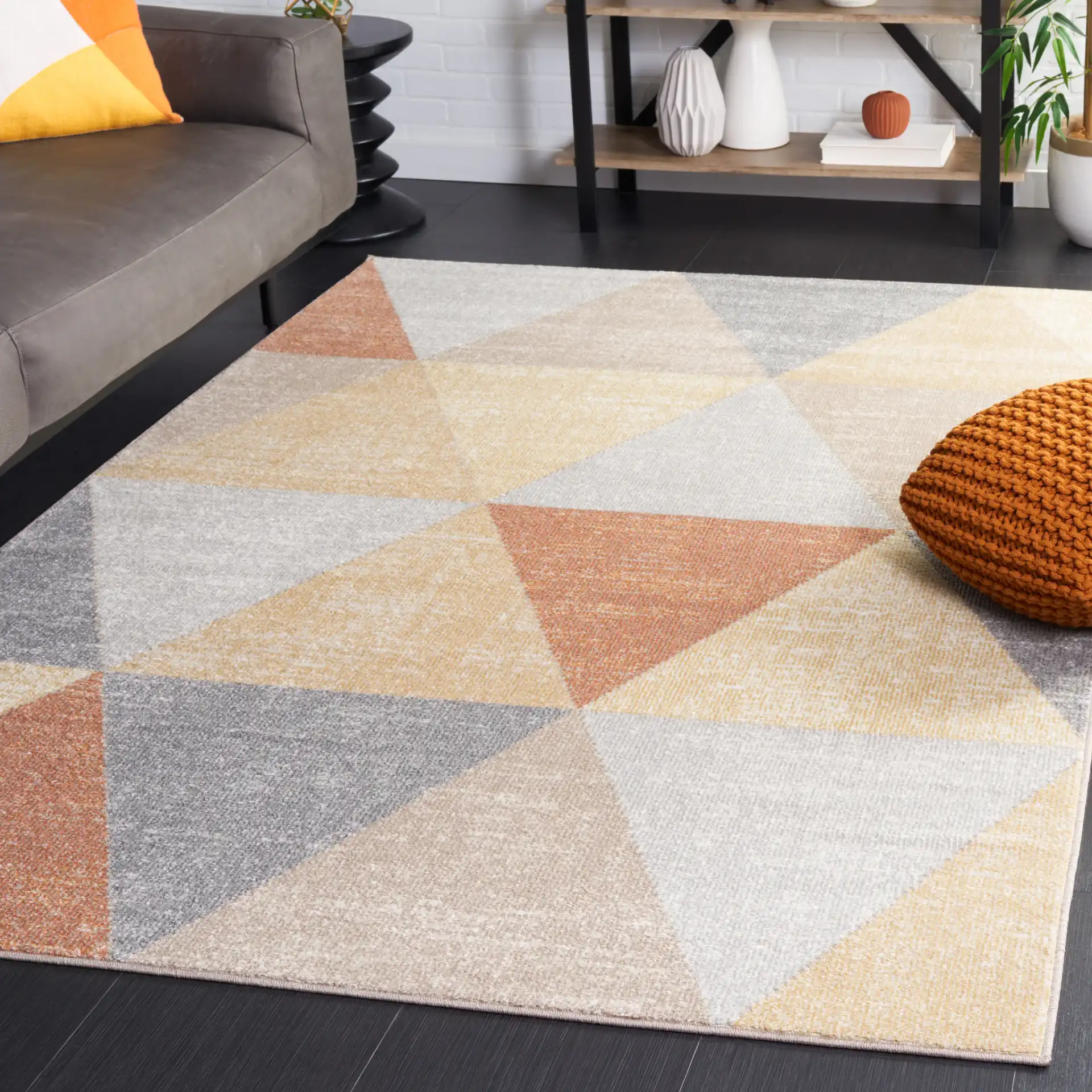 Phoenix Large Triangle Rug in Gray / Rust in a styled room