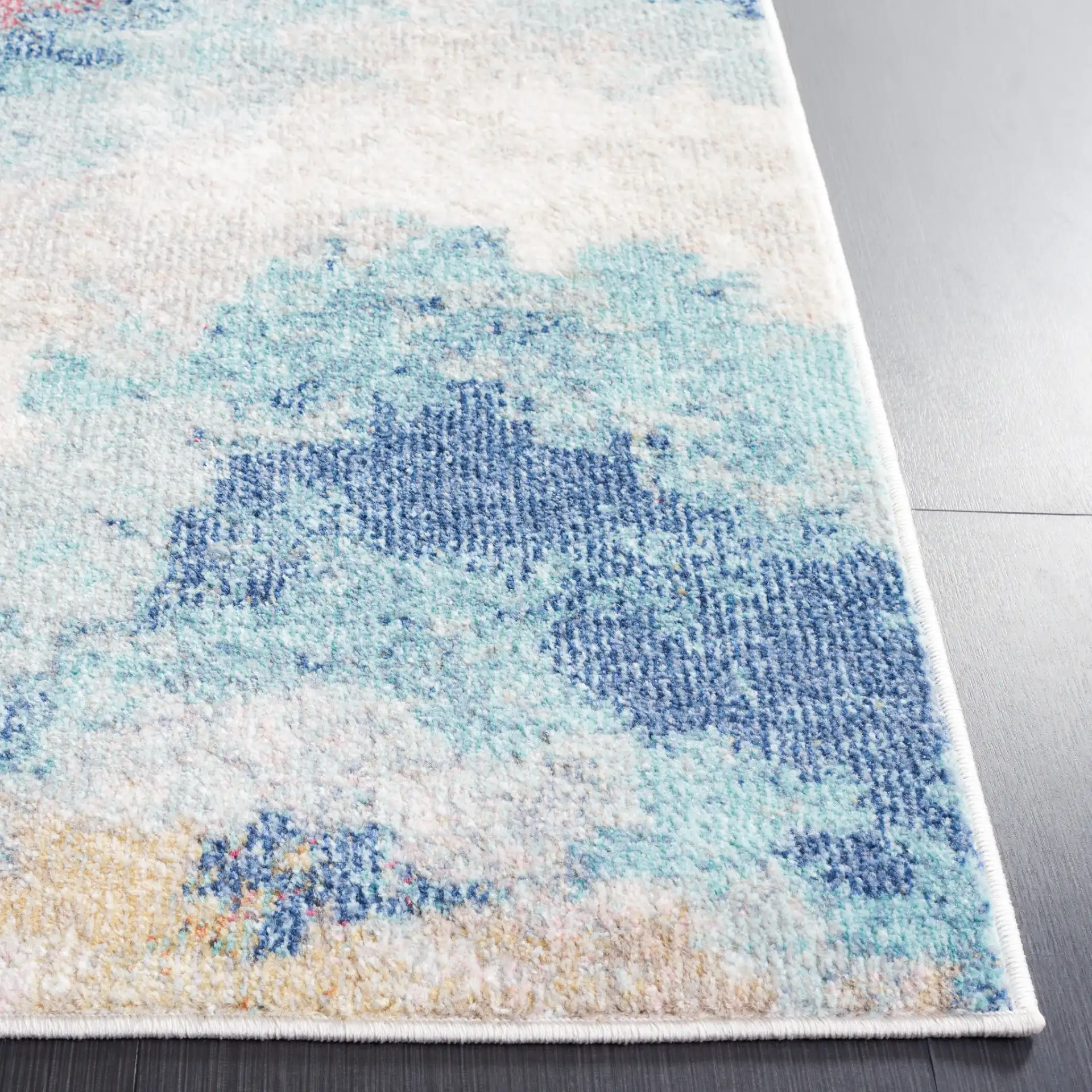 Phoenix Abstract Cloud Rug in Ivory / Blue Rust in a styled room