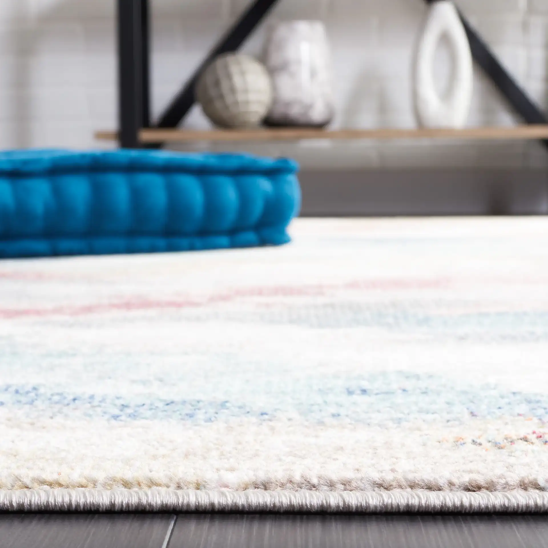 Phoenix Abstract Cloud Rug in Ivory / Blue Rust in a styled room