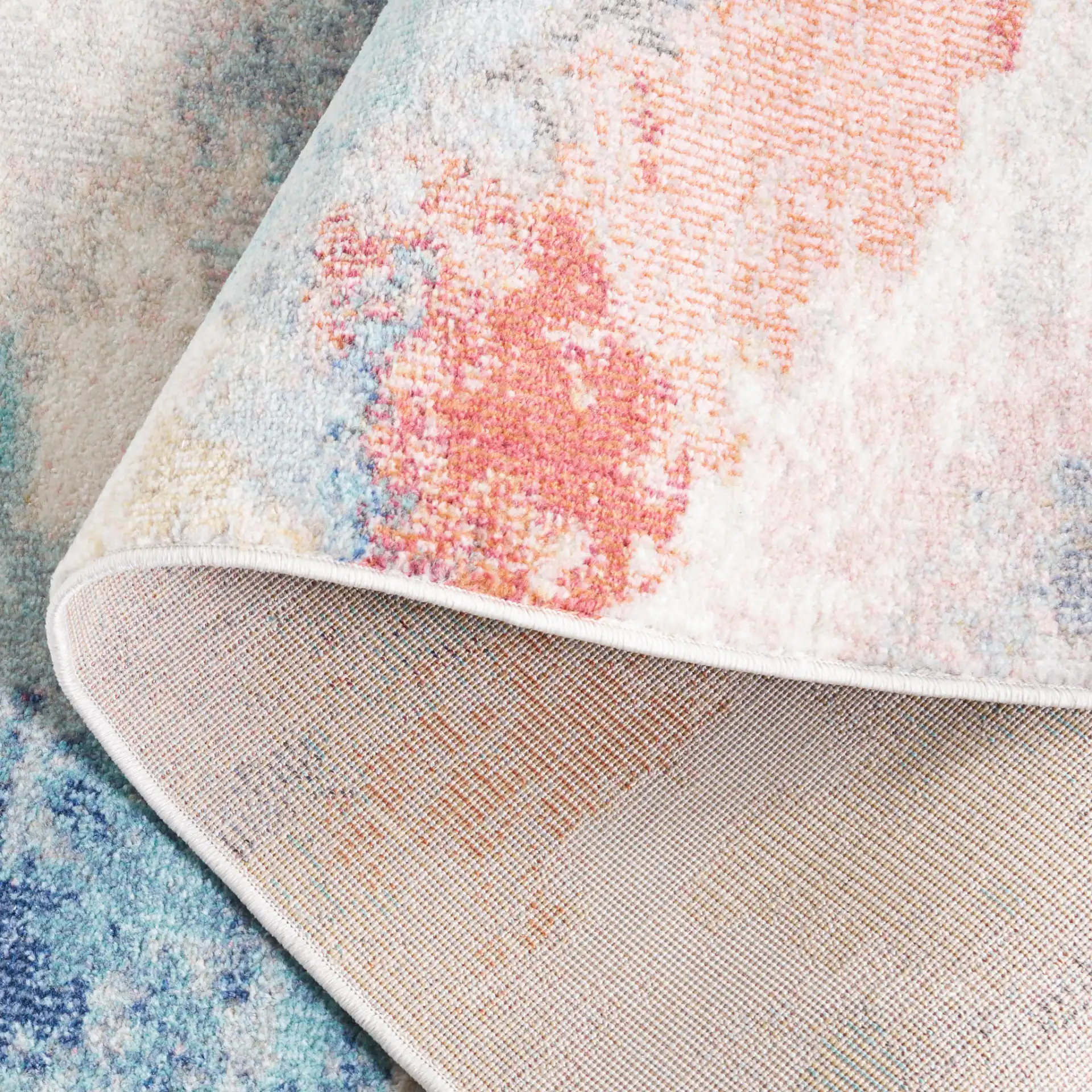 Phoenix Abstract Cloud Rug in Ivory / Blue Rust in a styled room