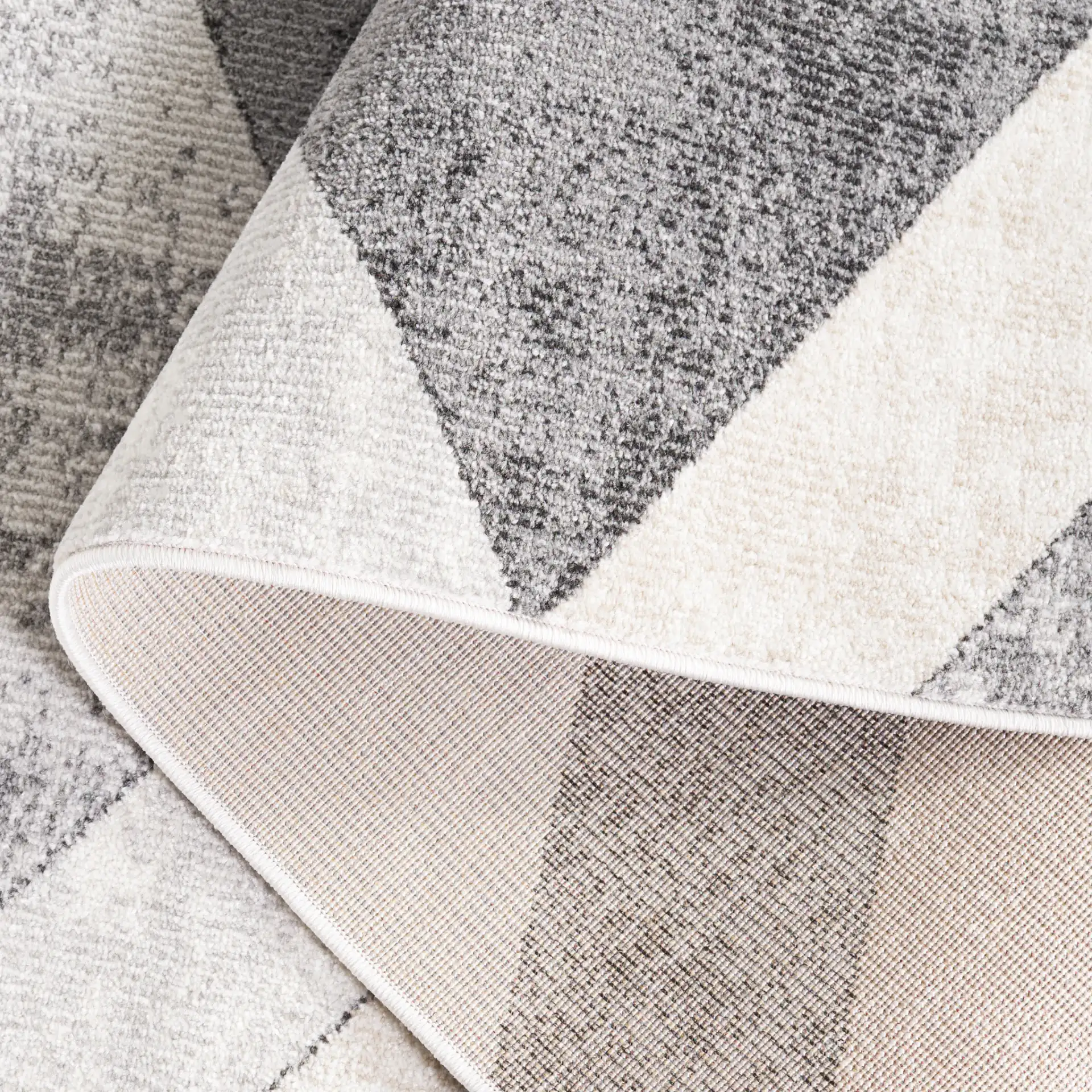 Phoenix Geometric Cube Rug in Light Gray / Beige Charcoal in a styled room
