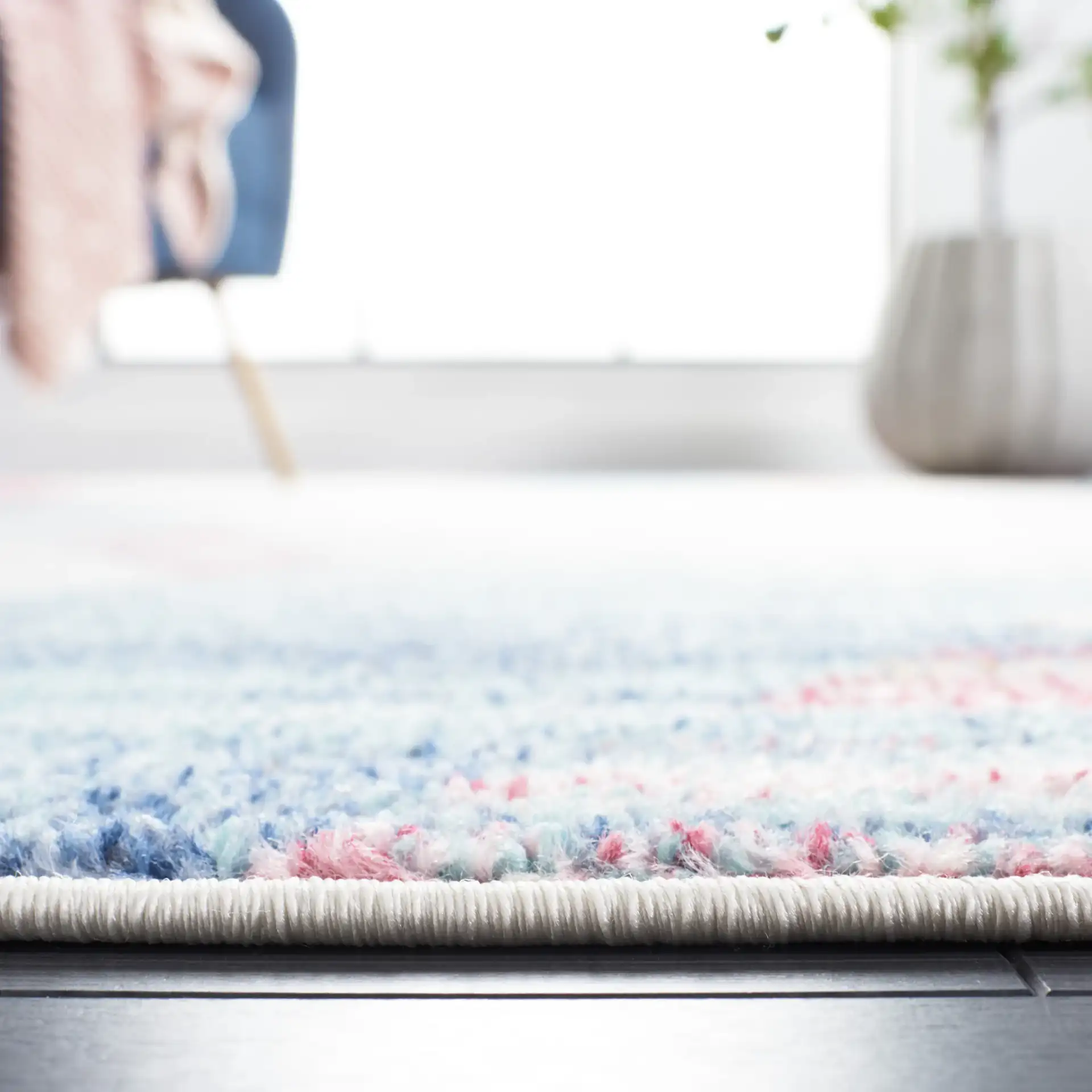 Phoenix Striated Diamond Rug in Ivory / Blue in a styled room