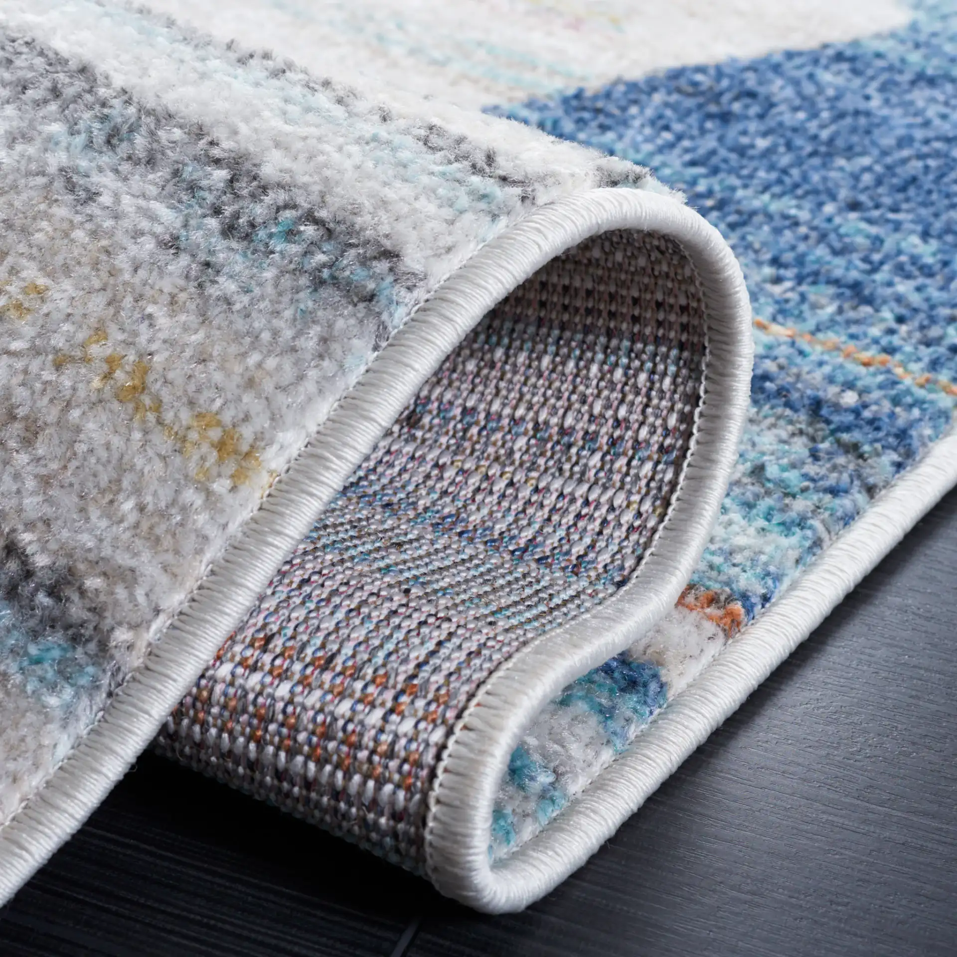 Phoenix Striated Diamond Rug in Ivory / Blue in a styled room