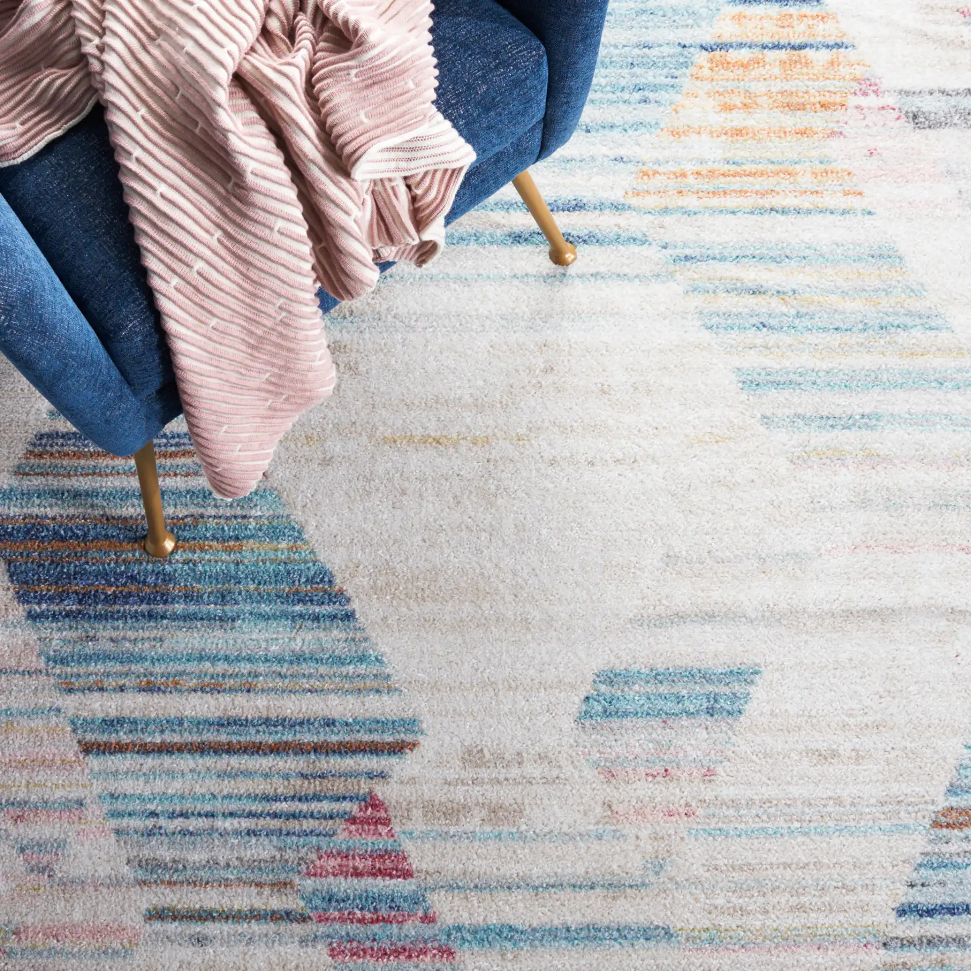 Phoenix Striated Diamond Rug in Ivory / Blue in a styled room